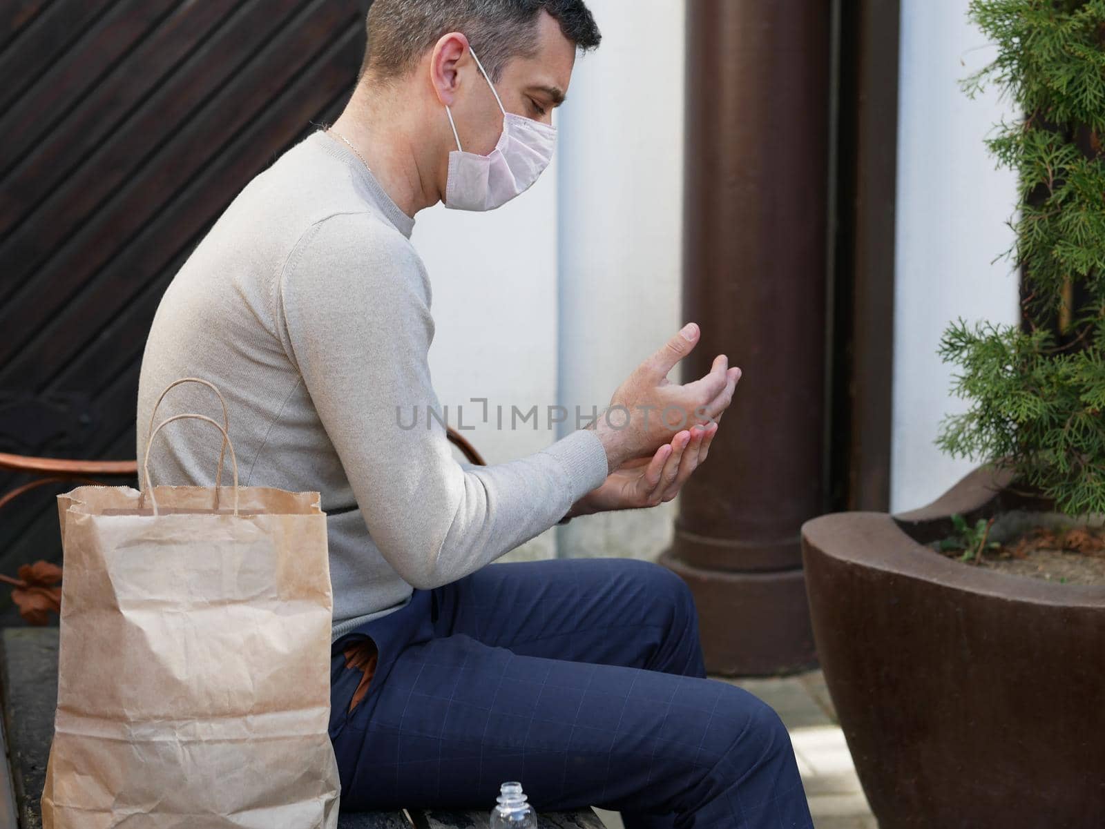 Person is using hand sanitizer disinfecting gel to wash hands while outdoor. Corona concept. COVID-19 virus. Coronavirus.