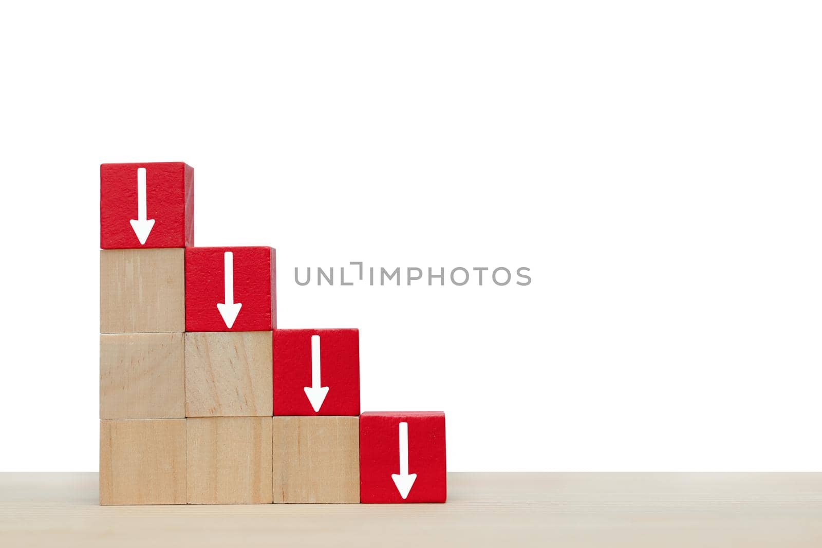 Arrow pointing down on red wooden block.  Symbol of the fall of investment or businesses by Buttus_casso