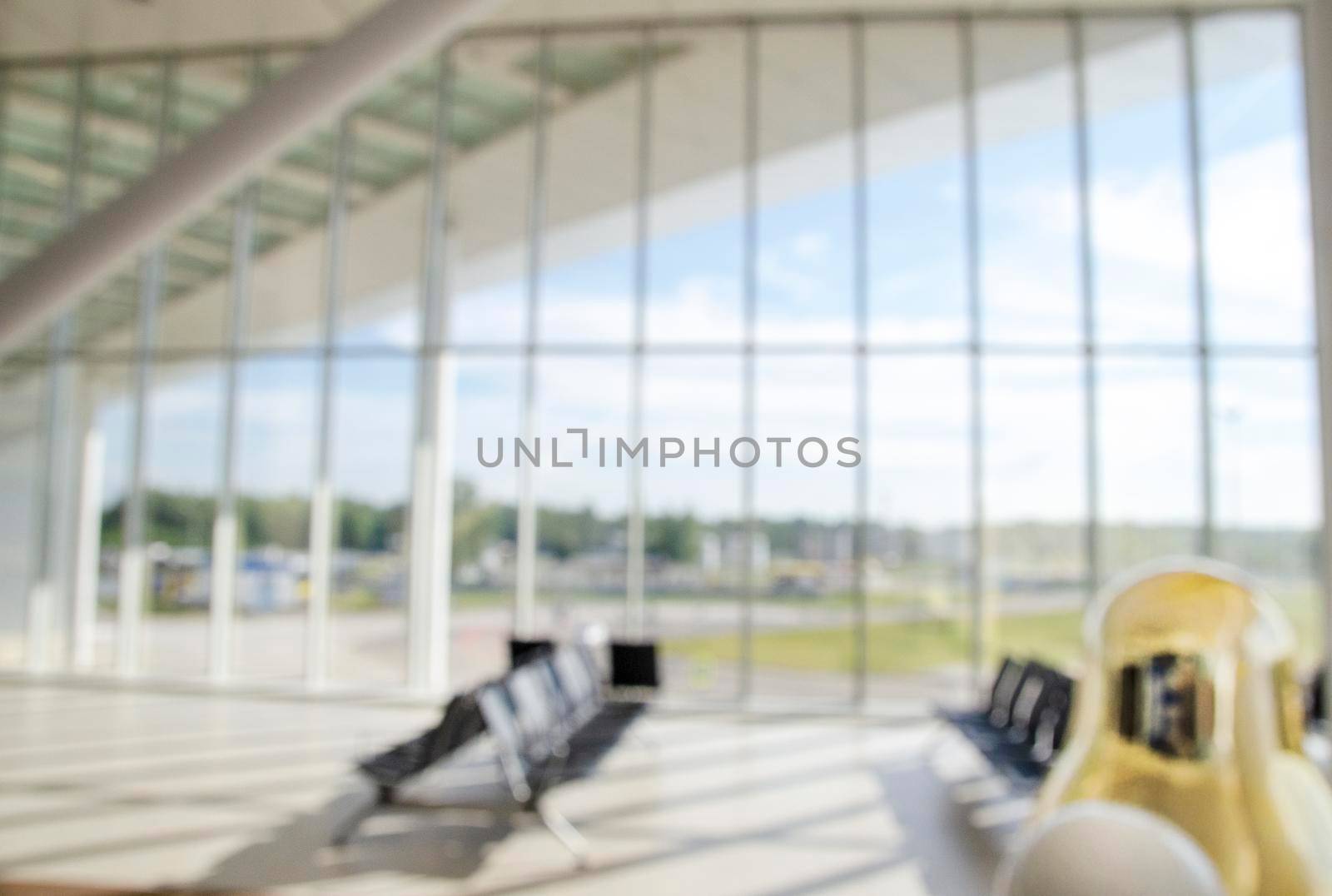 Blurred seat for passenger waiting fight in airport. by Jyliana