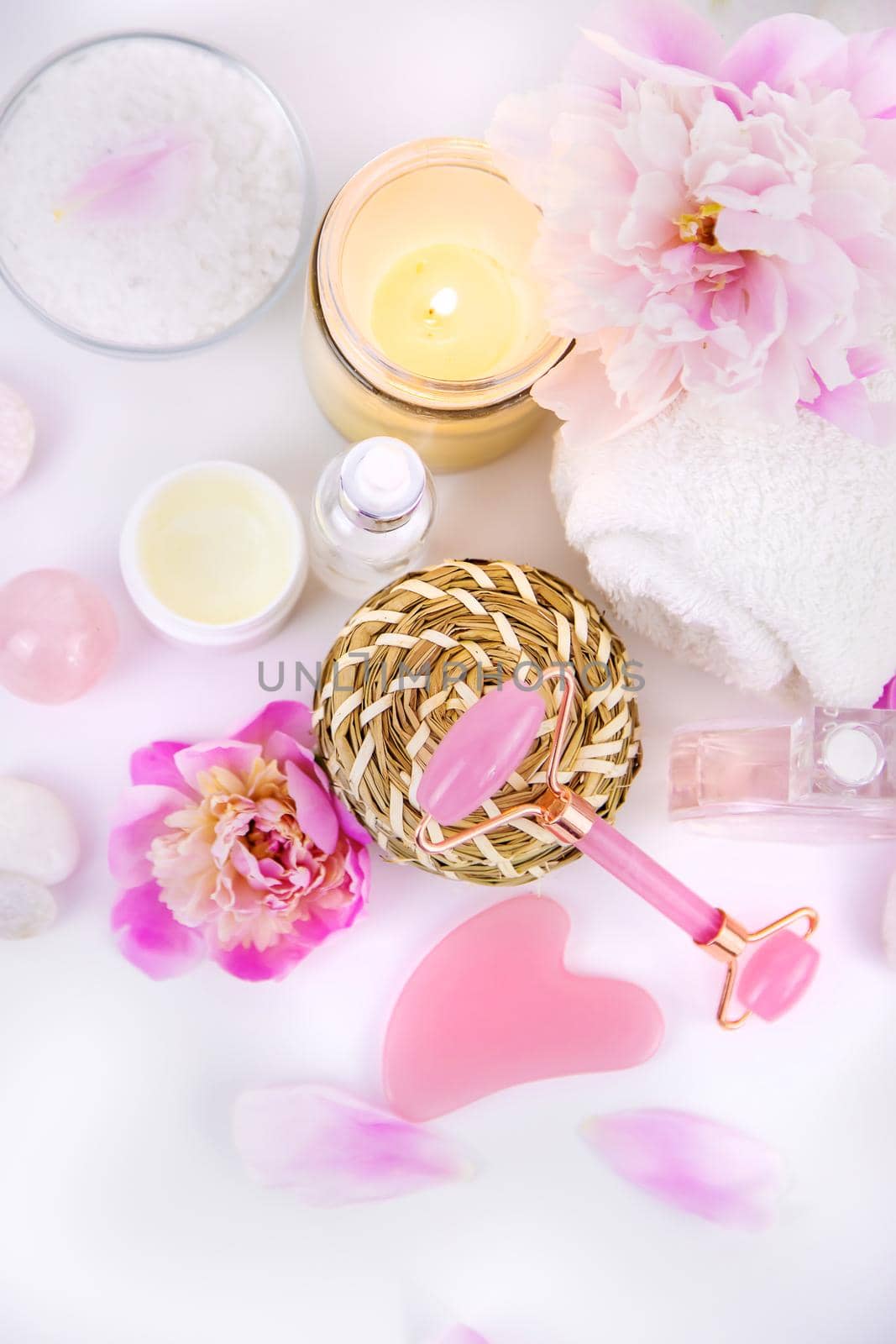 Pink flowers on white background spa facial. Selective focus. by yanadjana