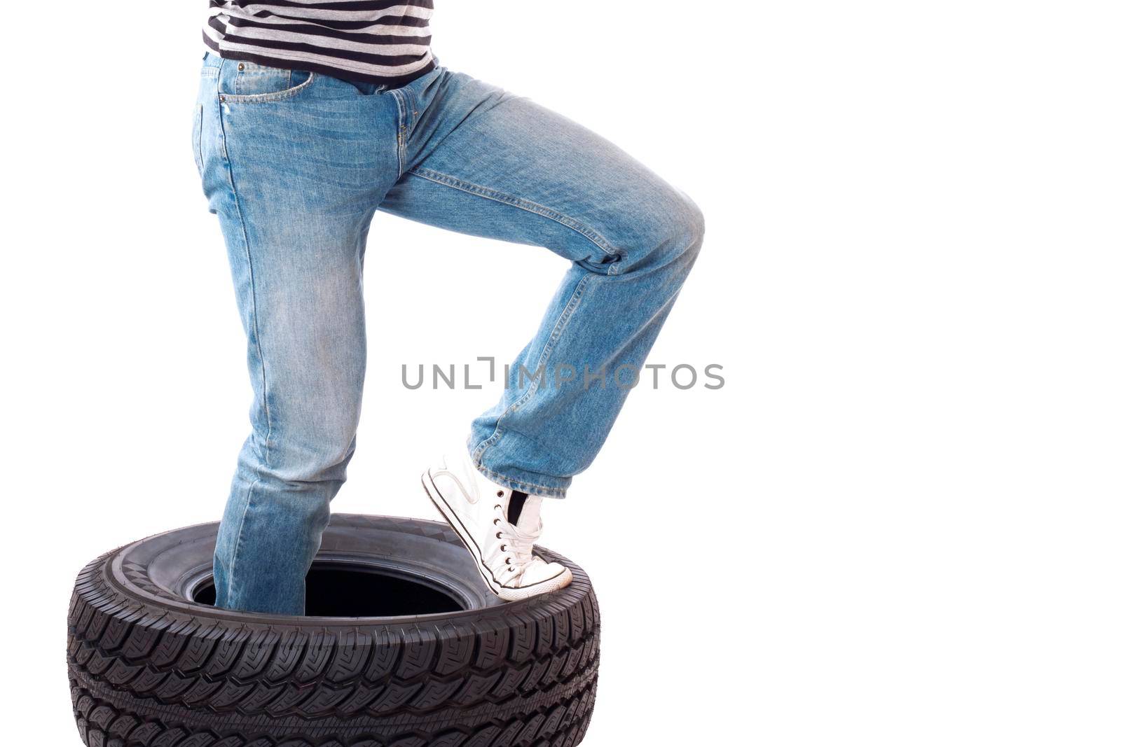 Man with car wheel or Tire. Isolated on white.