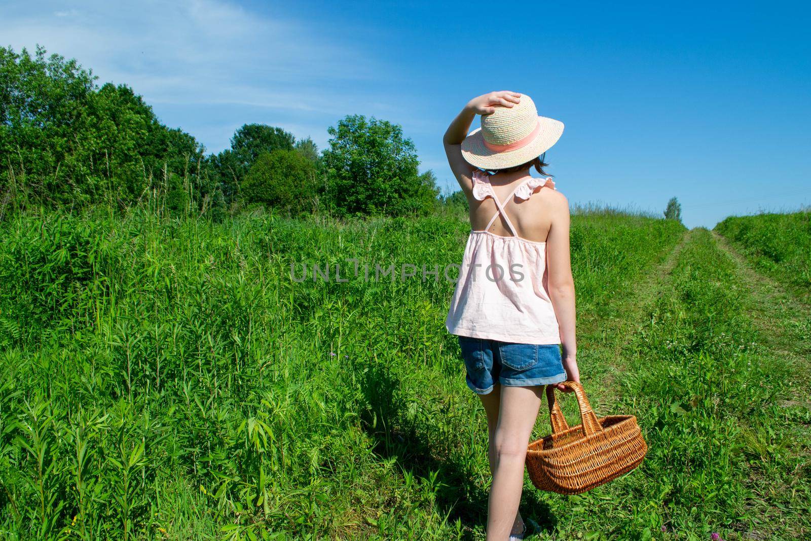 Little cute girl in the hat close-up portrait outdoors. The concept of a happy childhood. High quality photo