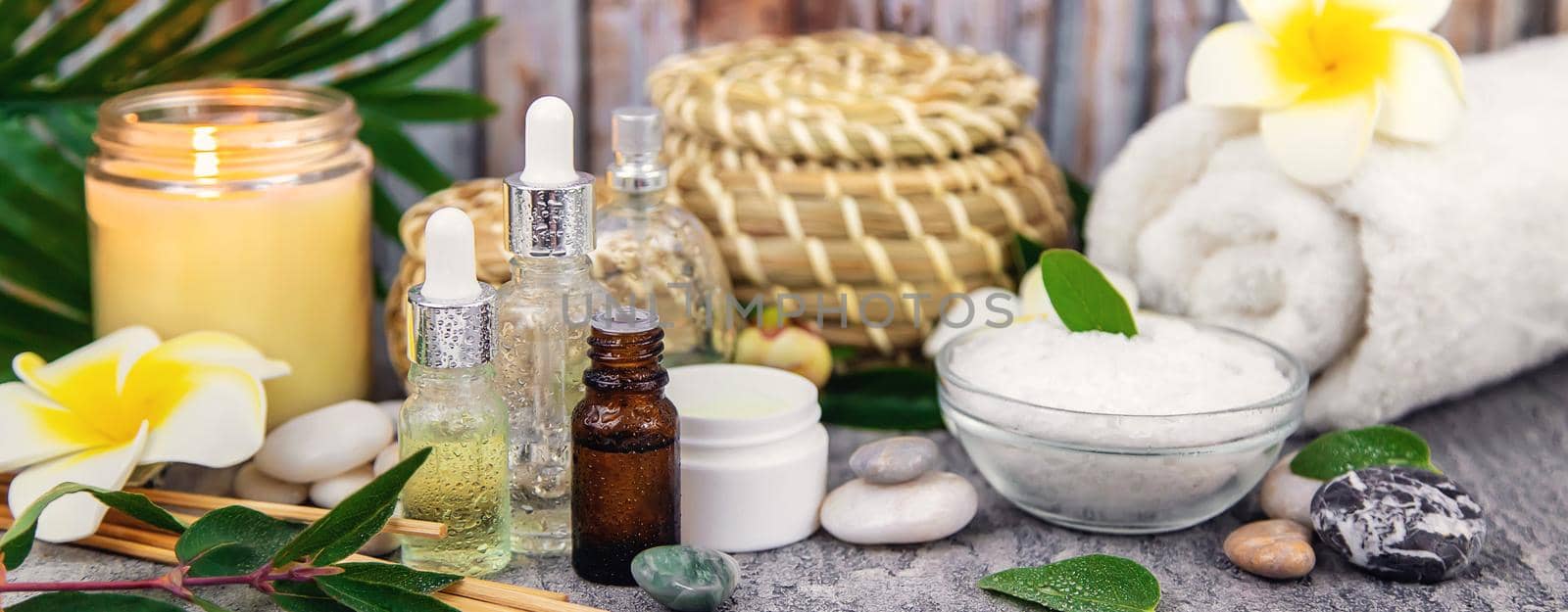 Background spa cosmetics and oils and herbs. Selective focus. by yanadjana