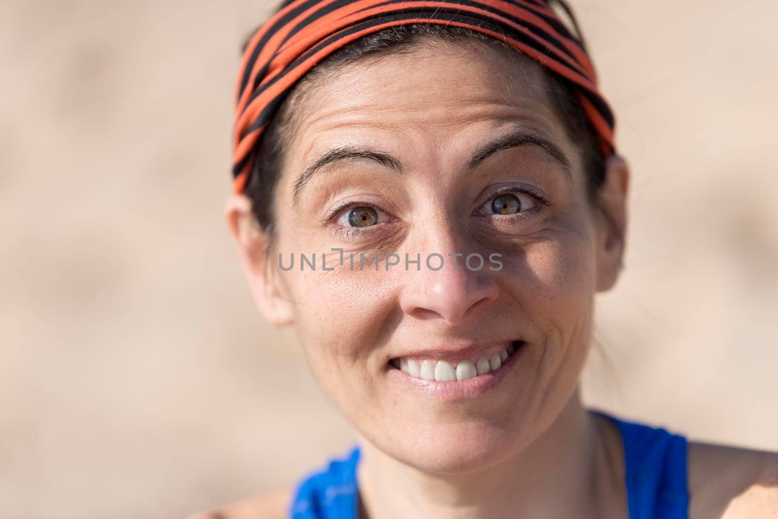 Headshot Close-up portrait of a casually runner woman smiling, by raferto1973