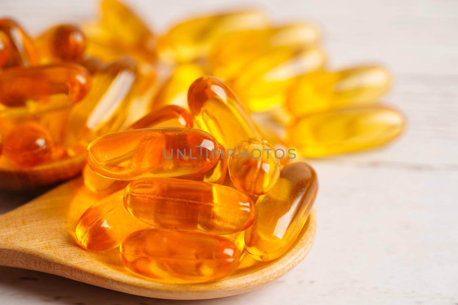 Fish oil or Cod liver oil gel in capsules with omega 3 vitamins, supplementary healthy food 