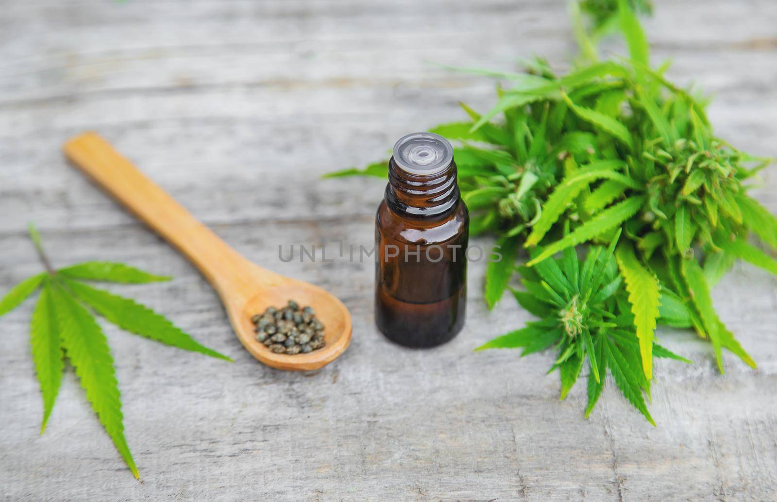 Cannabis oil in a small bottle. Selective focus. nature.