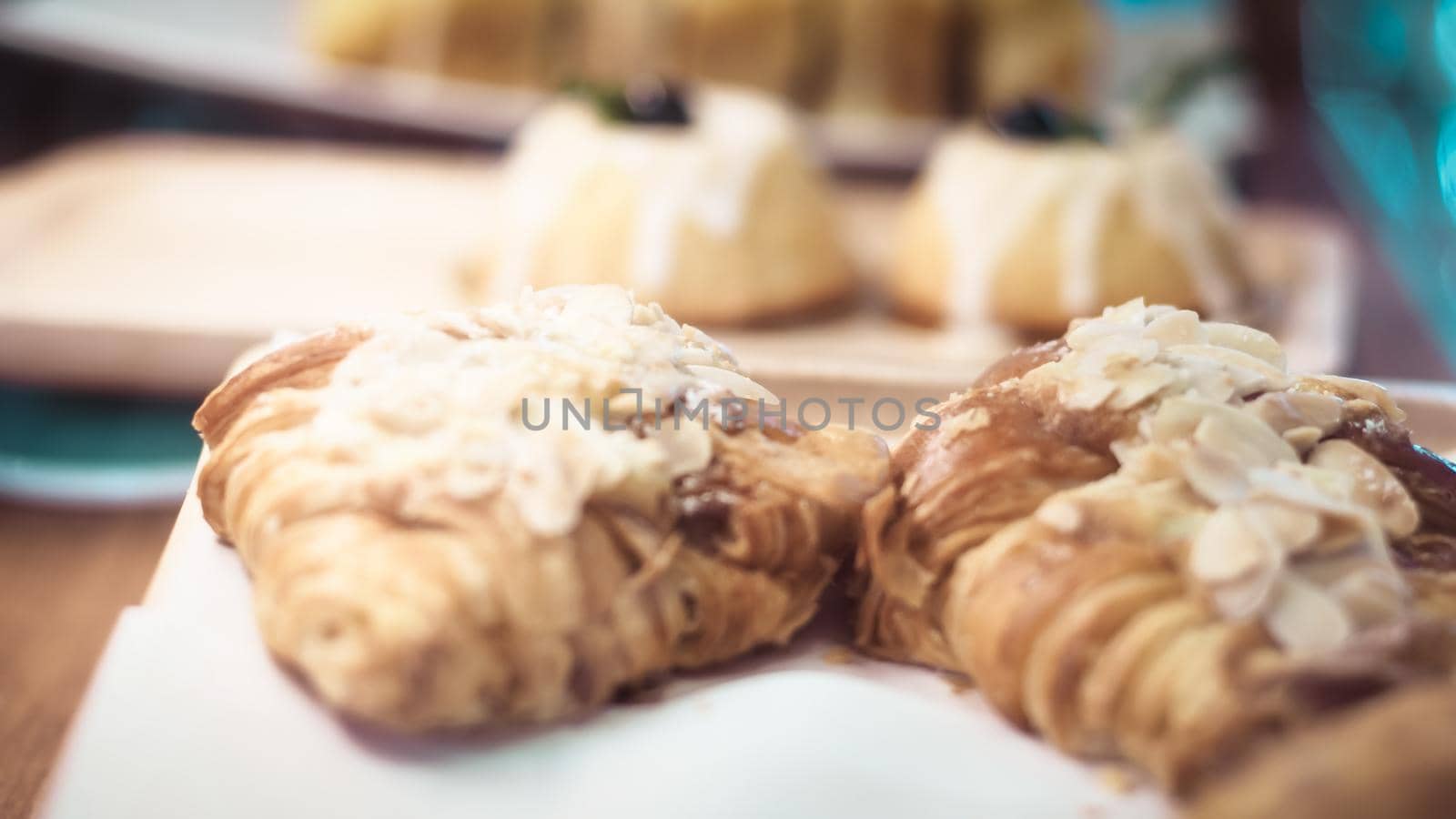 Delicious breakfast with fresh croissants and coffee served with butter and honey.