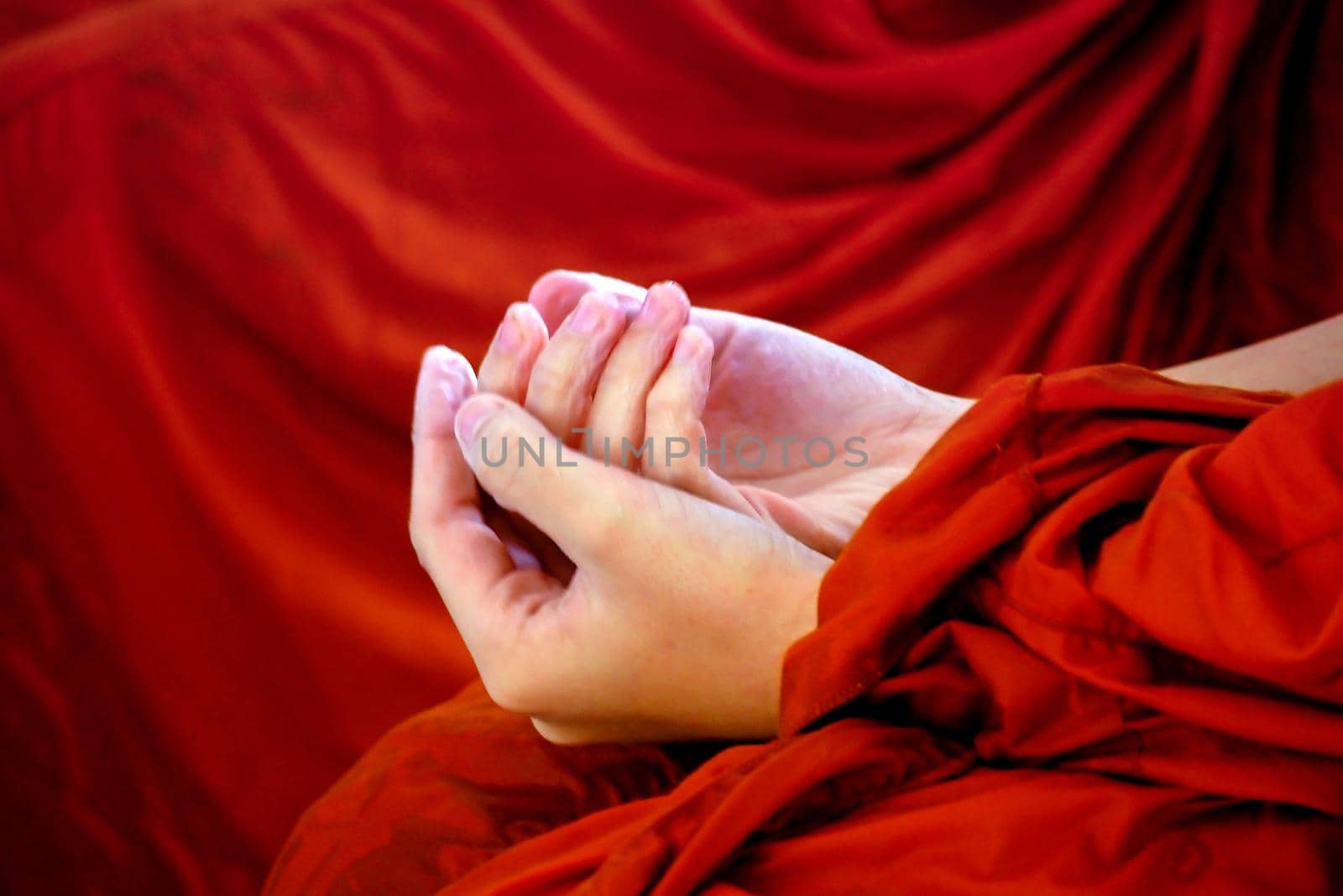 Monk wrinkled hand because of soak in the water . Son-gran Fastival Thailand traditional in New year.