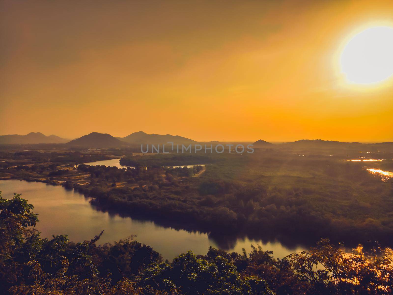 A beautiful valley in the Prachubkeereekhan Thailand, with a river running through the tropical forest sunset of summer.