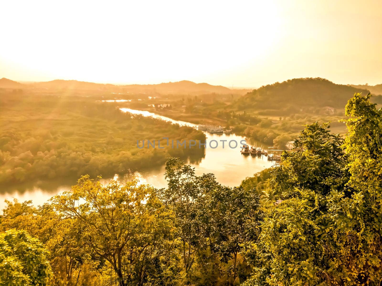 A beautiful valley in the Prachubkeereekhan Thailand, with a river running through the tropical forest sunset of summer.