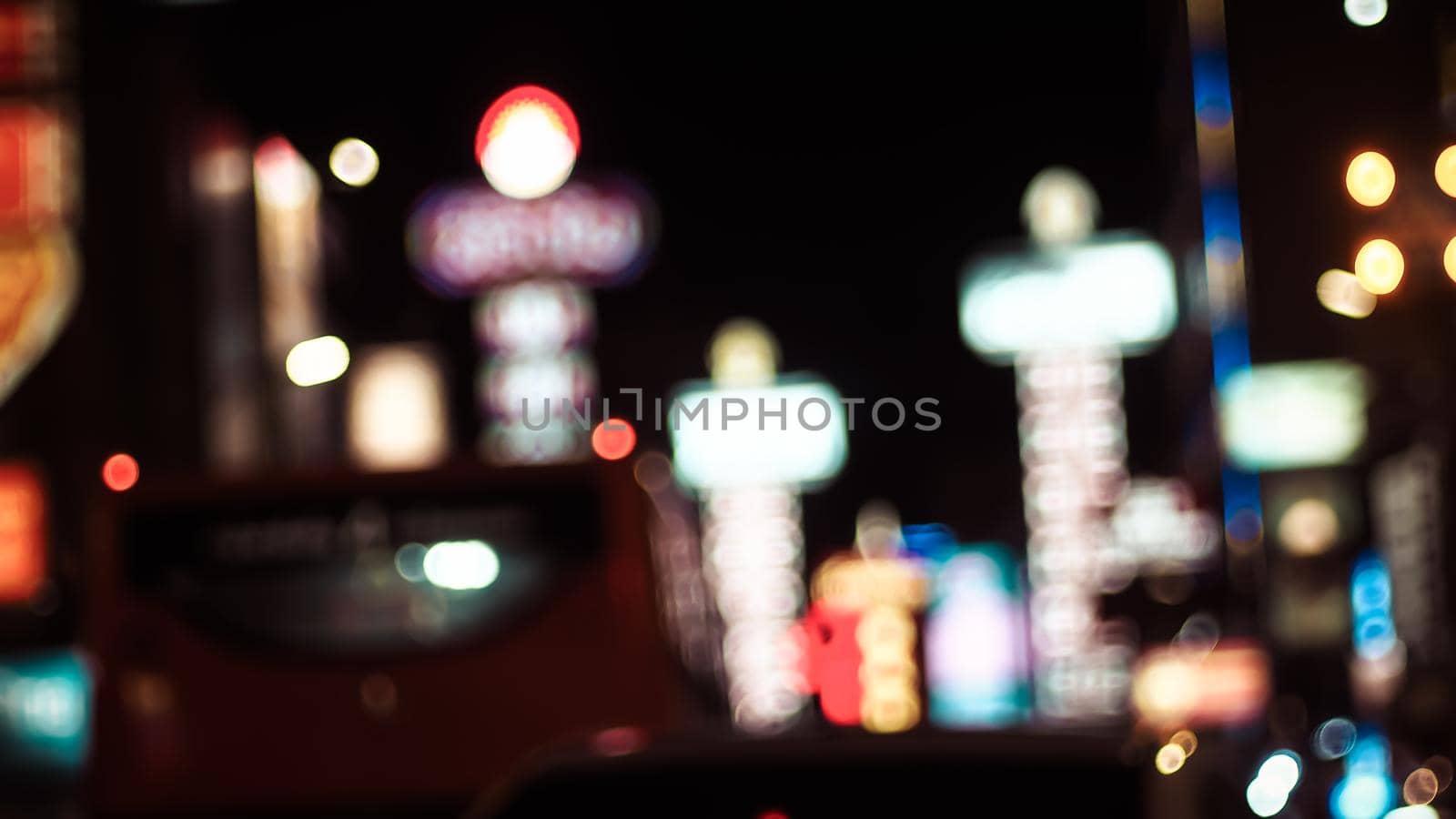 Defocused night Street lights. Bokeh Street lights from cars in the city. Chinese town in Bangkok Thailand by Petrichor