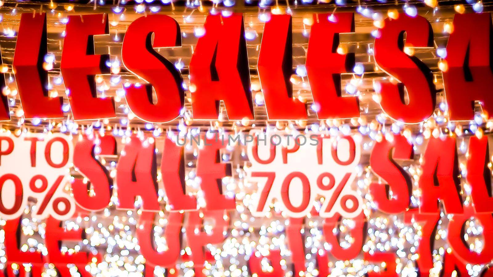 Store sale sign. Special offer banner with the red sale text gold bokeh blur background