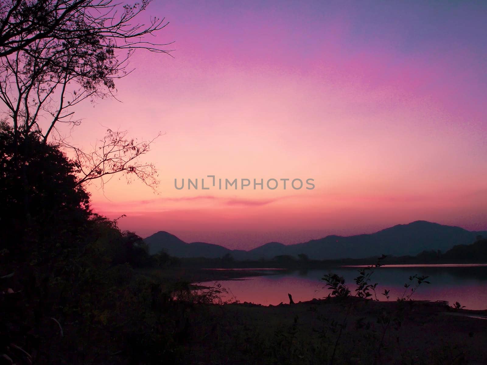 Mountain range at sunset, Lake. View on Mountain Lake in front of mountain range,