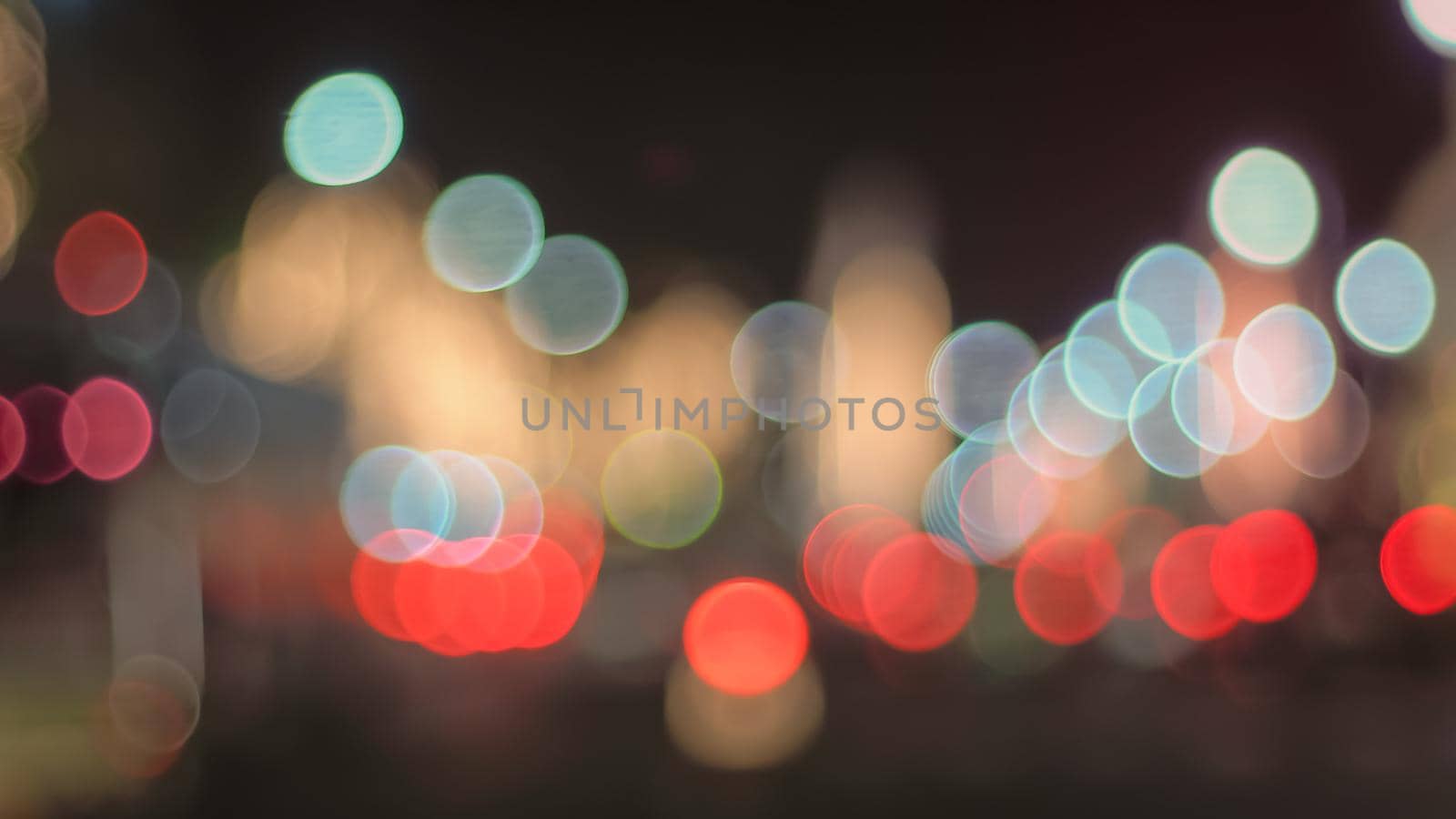 Defocused night Street lights. Bokeh street lights from cars in the city. by Petrichor