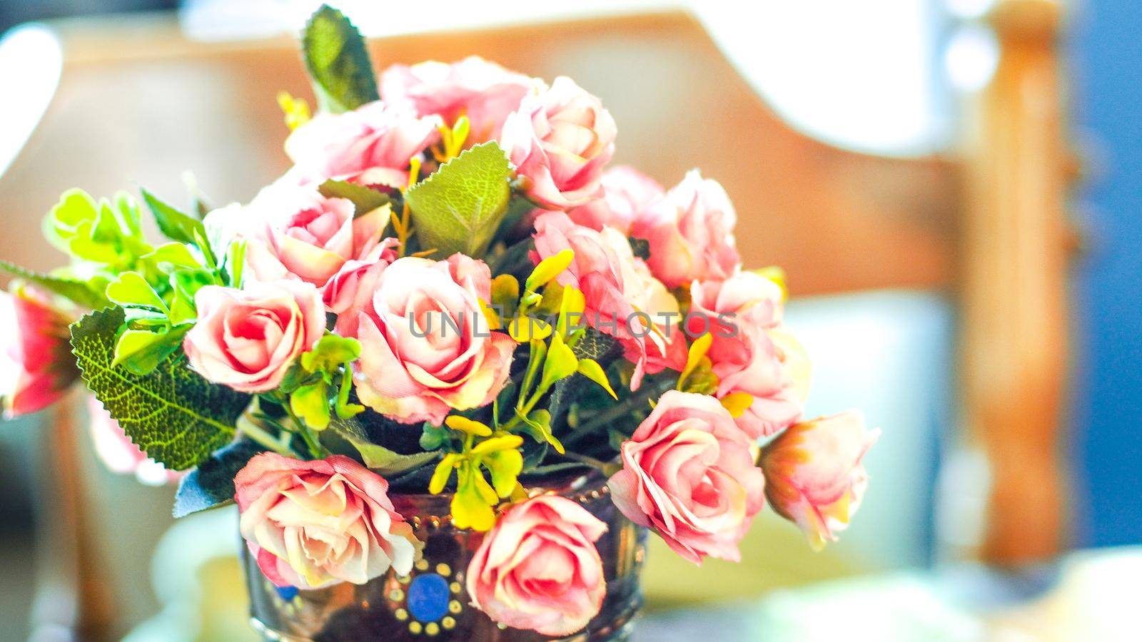 Bouquet vintage group of pink roses on wooden table, soft focus by Petrichor
