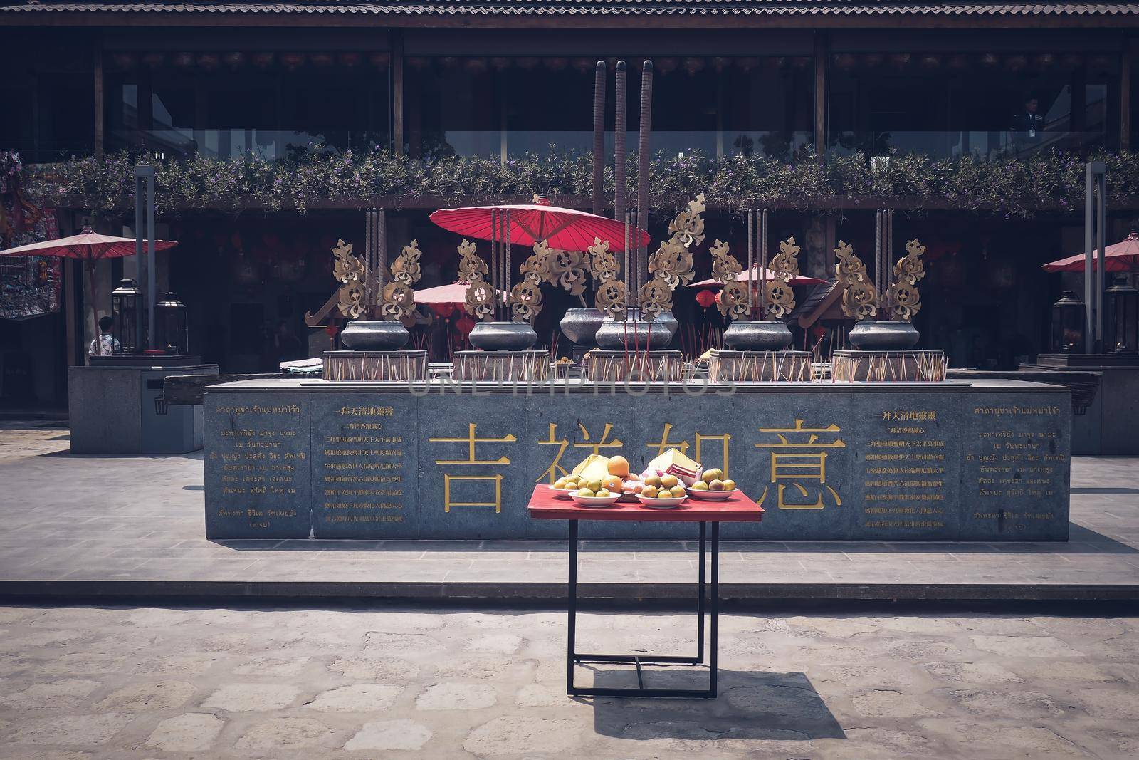 Praying and wishing a happy Chinese new year. Table with food and things for god