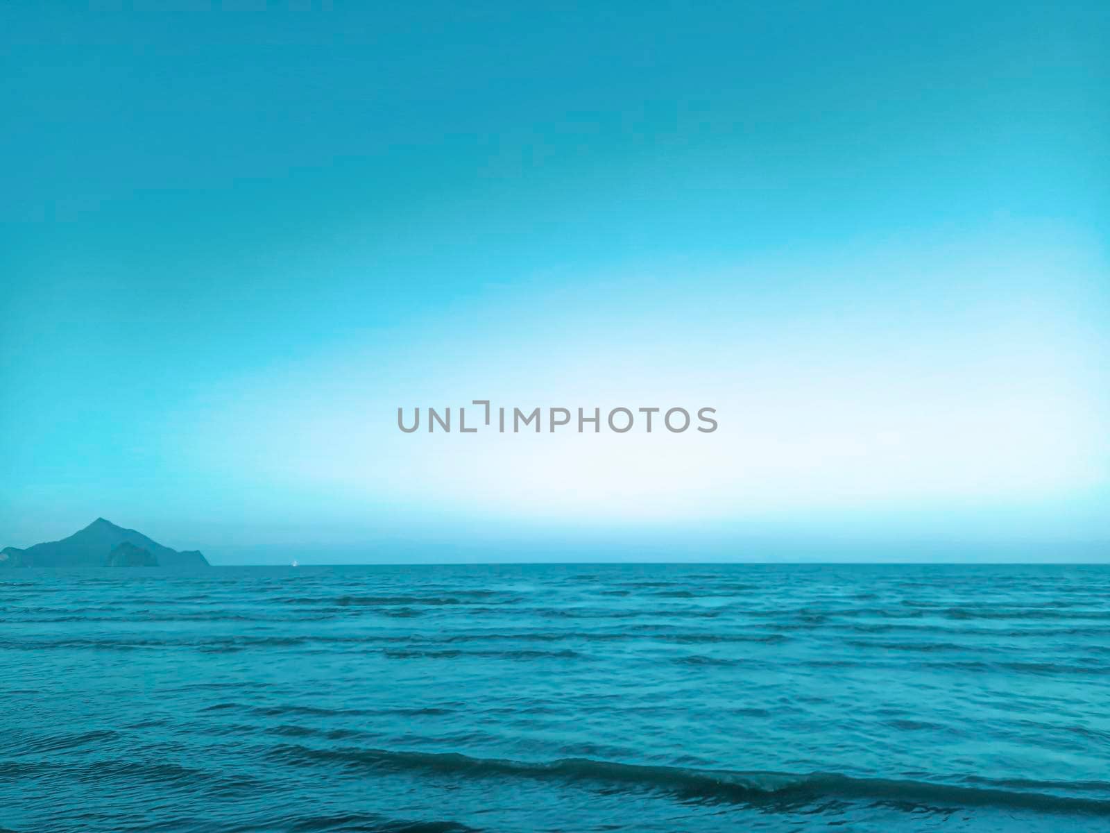 Sea and mountains landscape with blue gradient color. Summer holiday idea nature background