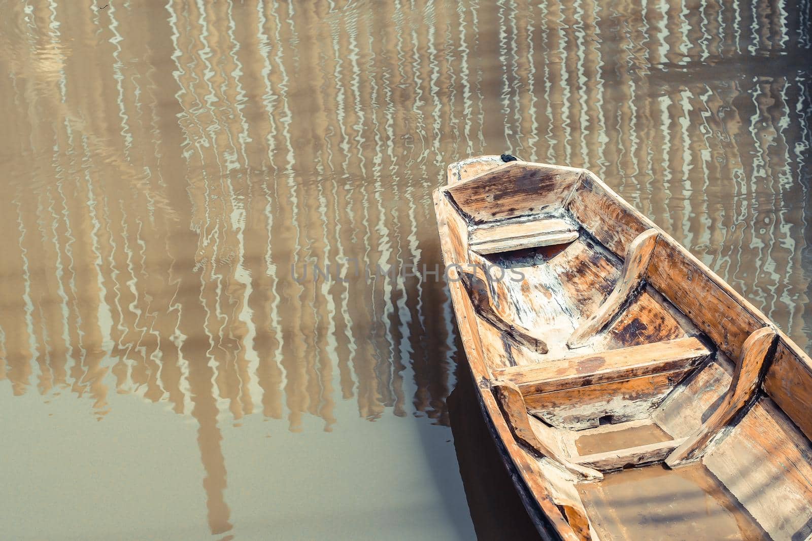 Lonely old wooden boat on the lake suburban traditional culture lifestyle