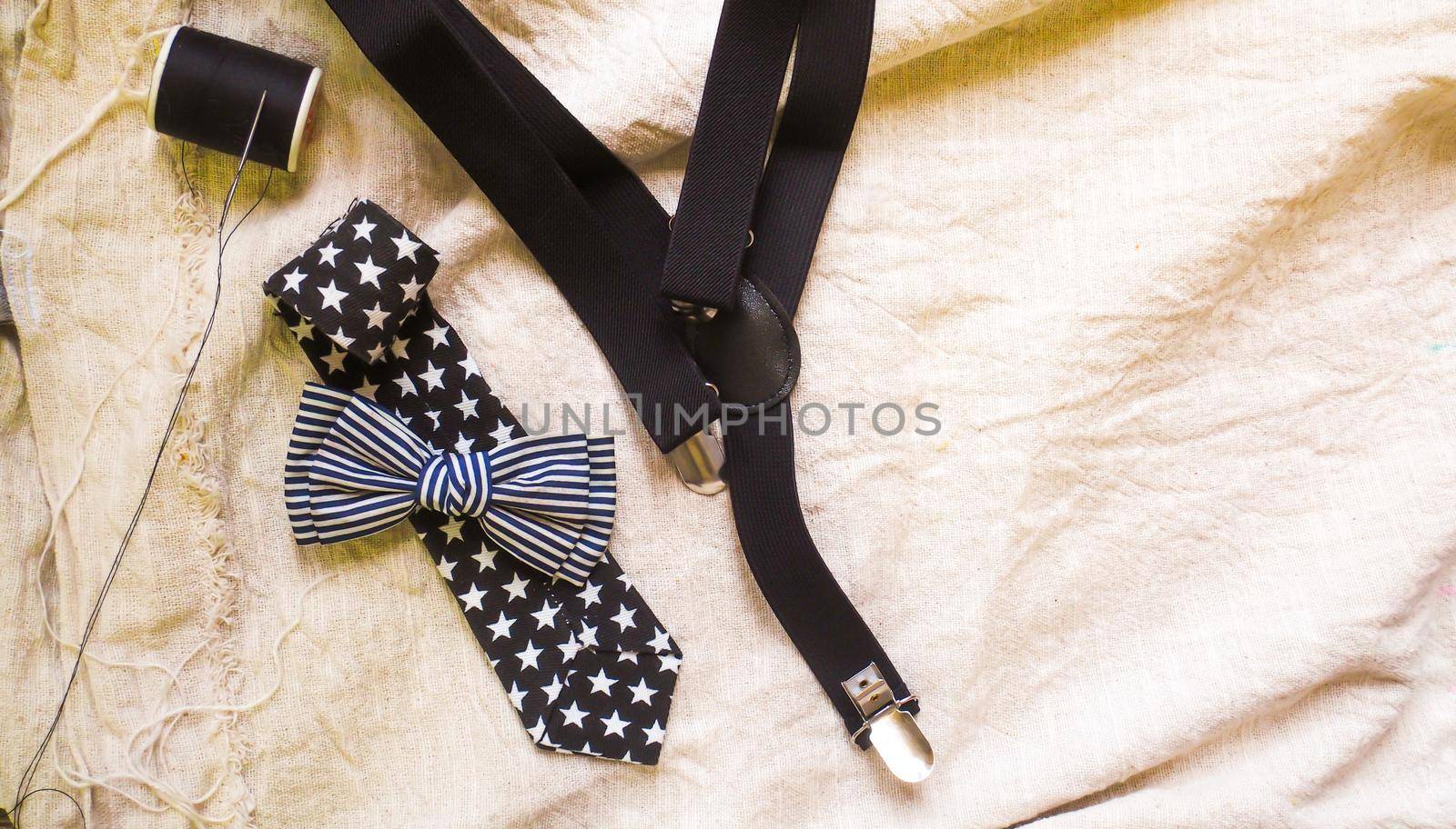 bow tie neck tie and braces for baby boy background