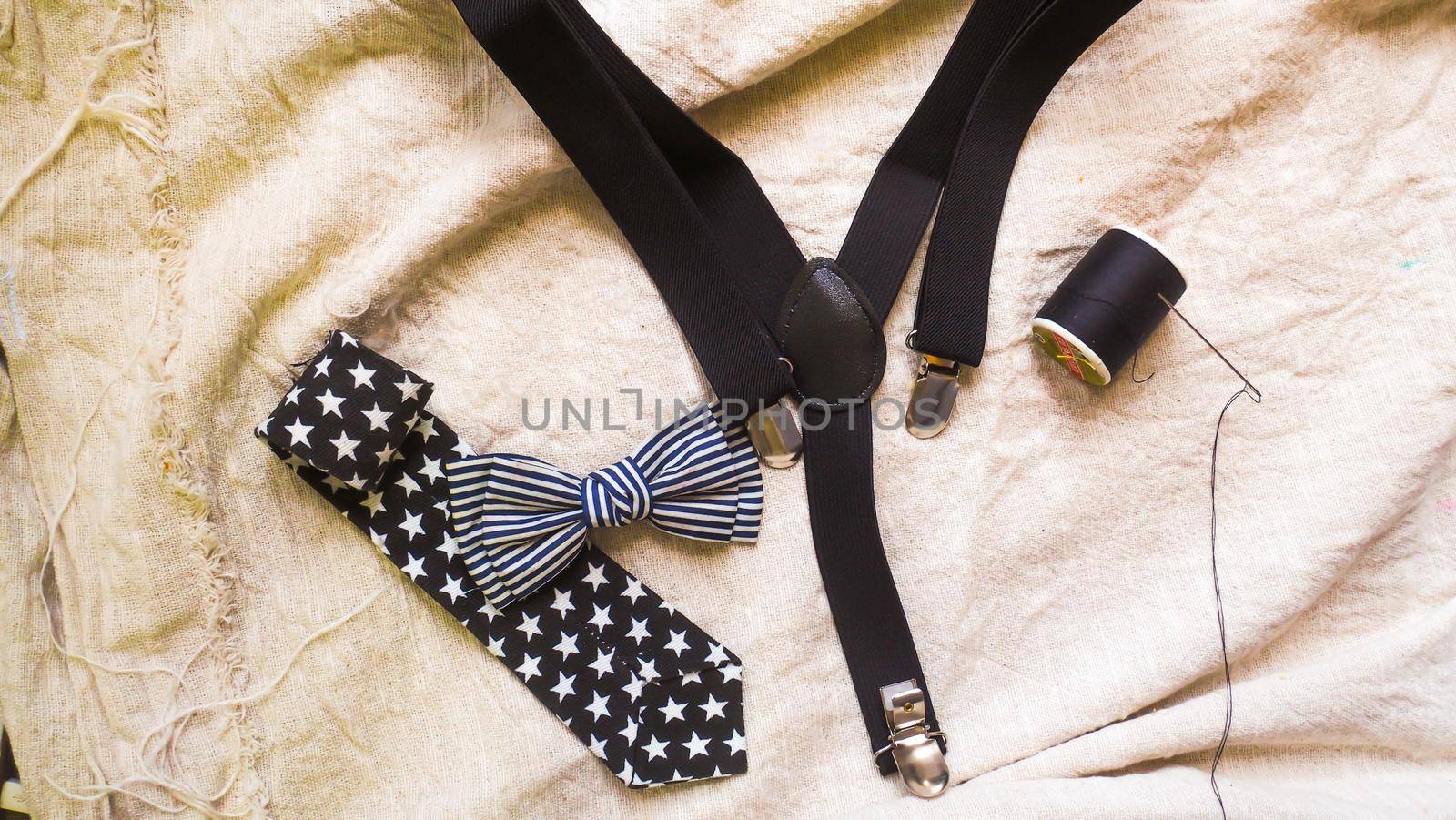 bow tie neck tie  and braces for baby boy background