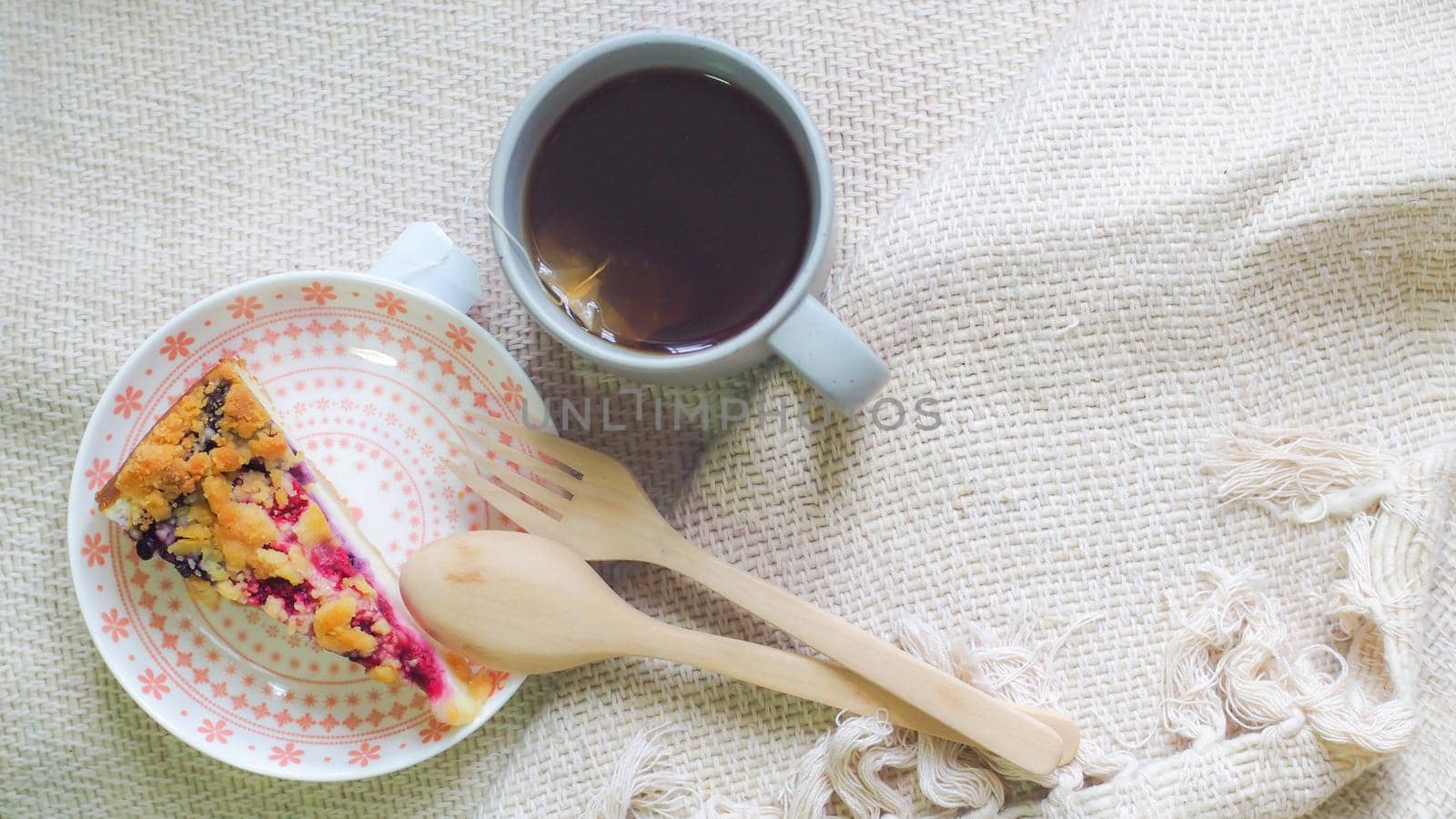 blueberry cheese cake on plate and a cup of coffee morning breakfast