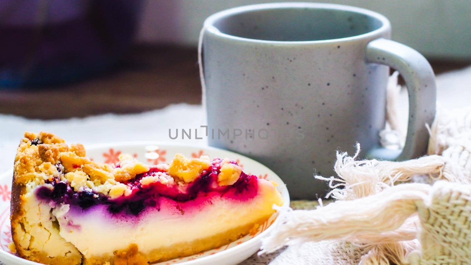 blueberry cheese cake on plate and a cup of coffee morning breakfast