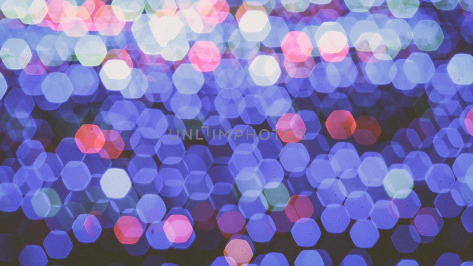 Abstract colorful bokeh light on golden background. Christmas and New Year theme