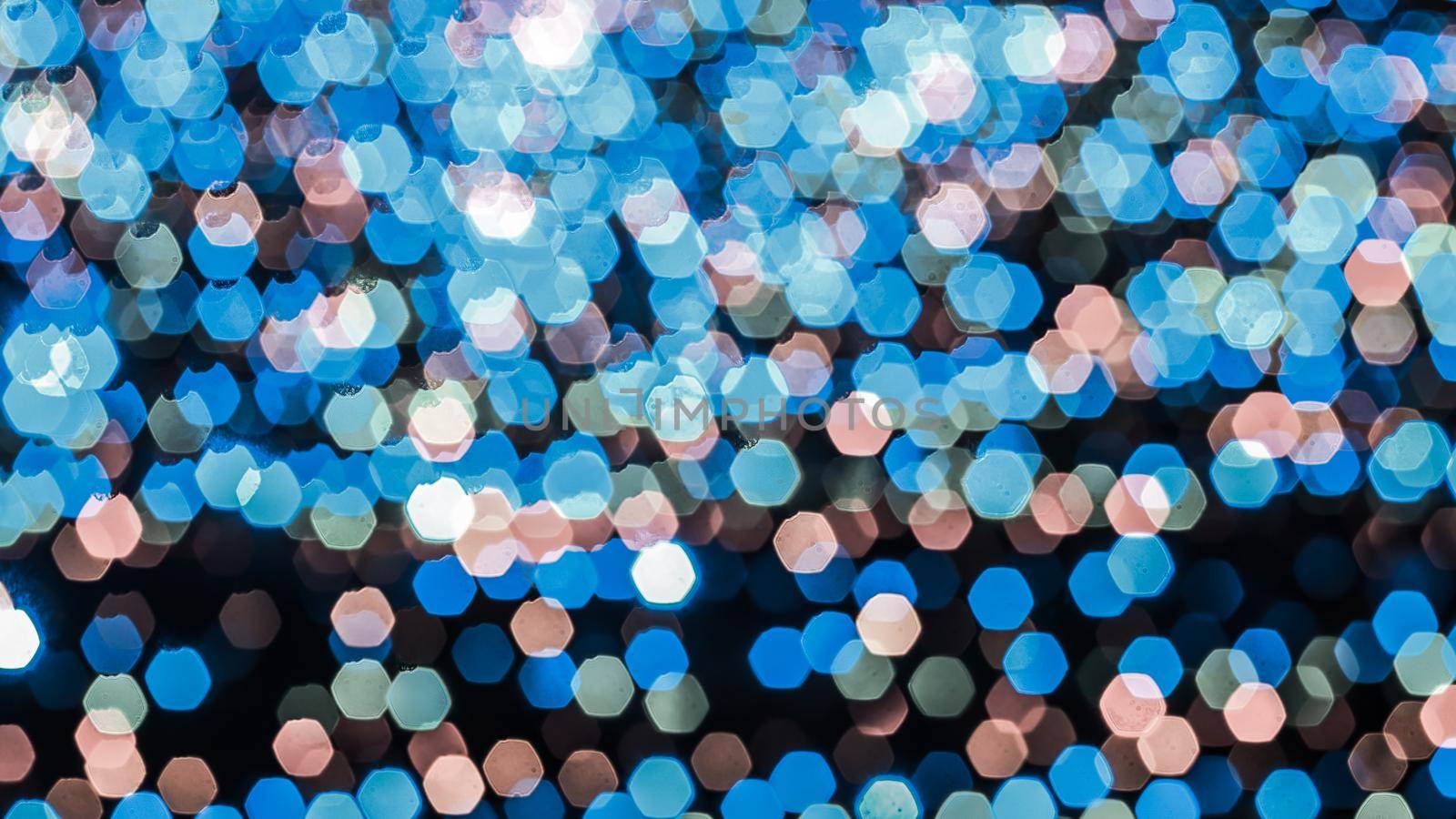 Abstract colorful bokeh light on dark background. Christmas and New Year theme