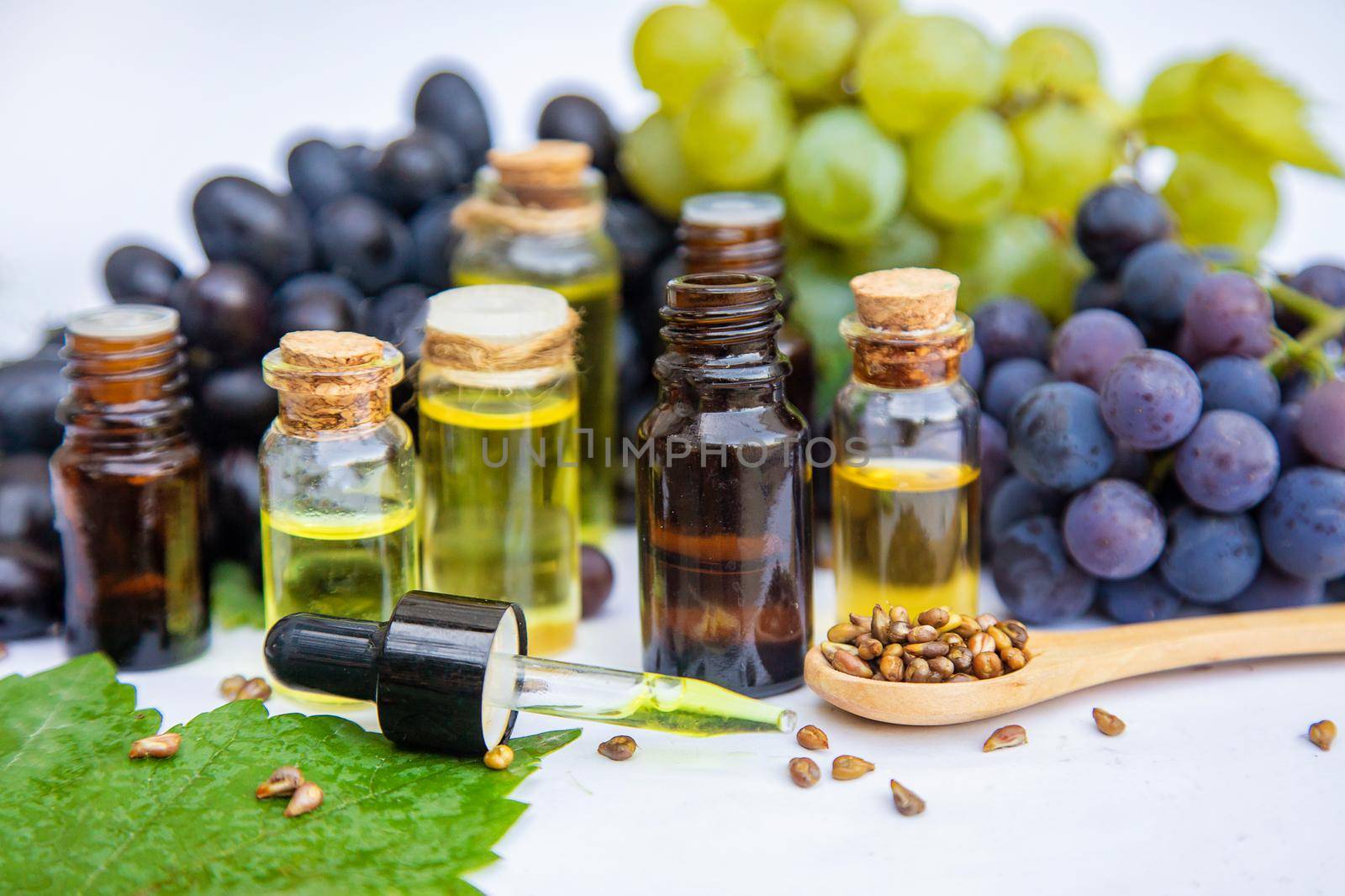 Grape seed oil in a small bottle. Selective focus. nature.