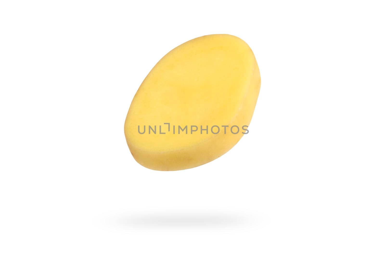 A slice of fresh unpeeled potatoes falls on a white background. Chopped raw potatoes. Food levitation concept. High resolution image.