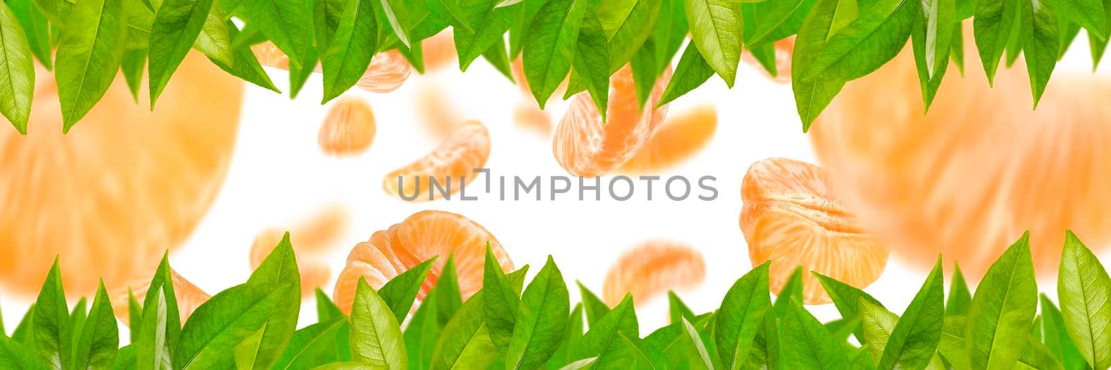 Falling mandarin slices on a white isolated background. Citrus fruit background, yellow tangerine slices with selective focus.