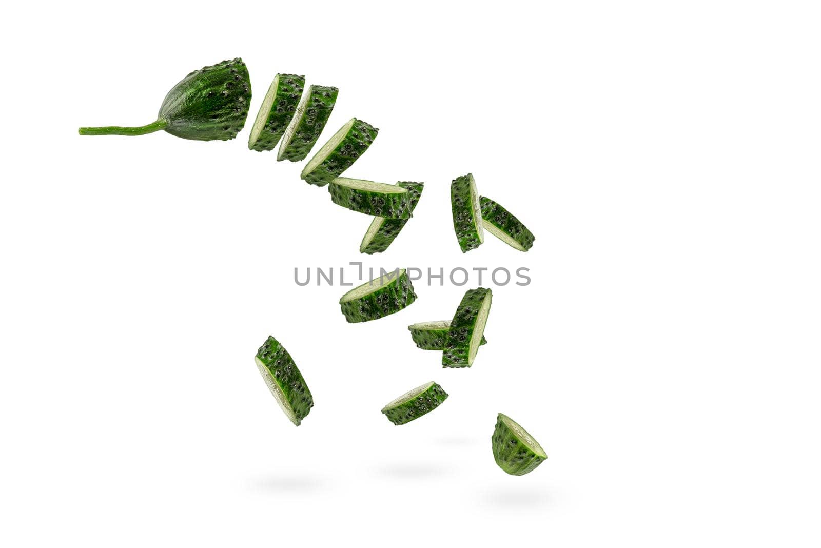 Falling cucumber slices on white isolated background. The cucumber scatters. Cut fresh cucumber into slices hanging in the air