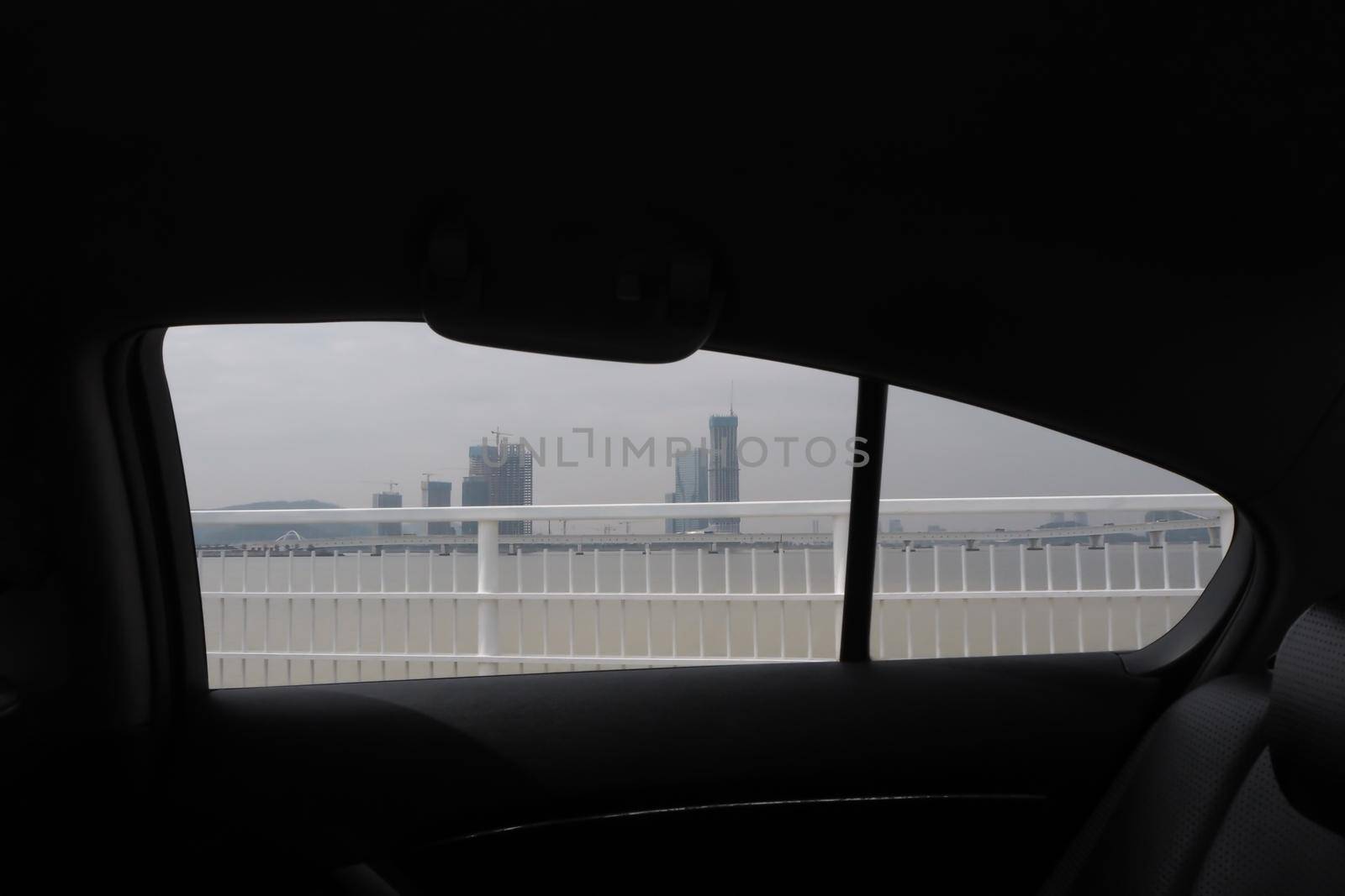 Looking through a car window with view of Central Park and a beautiful cityscape of Macau china