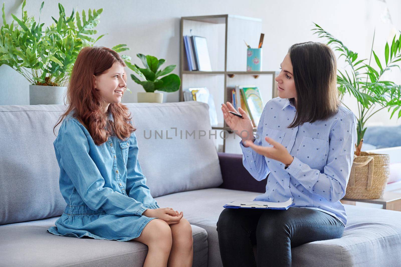 Female professional child psychologist working with preteen girl in office. Childrens mental health, problems at school family, individual therapy. Psychology psychiatry social difficulties childhood