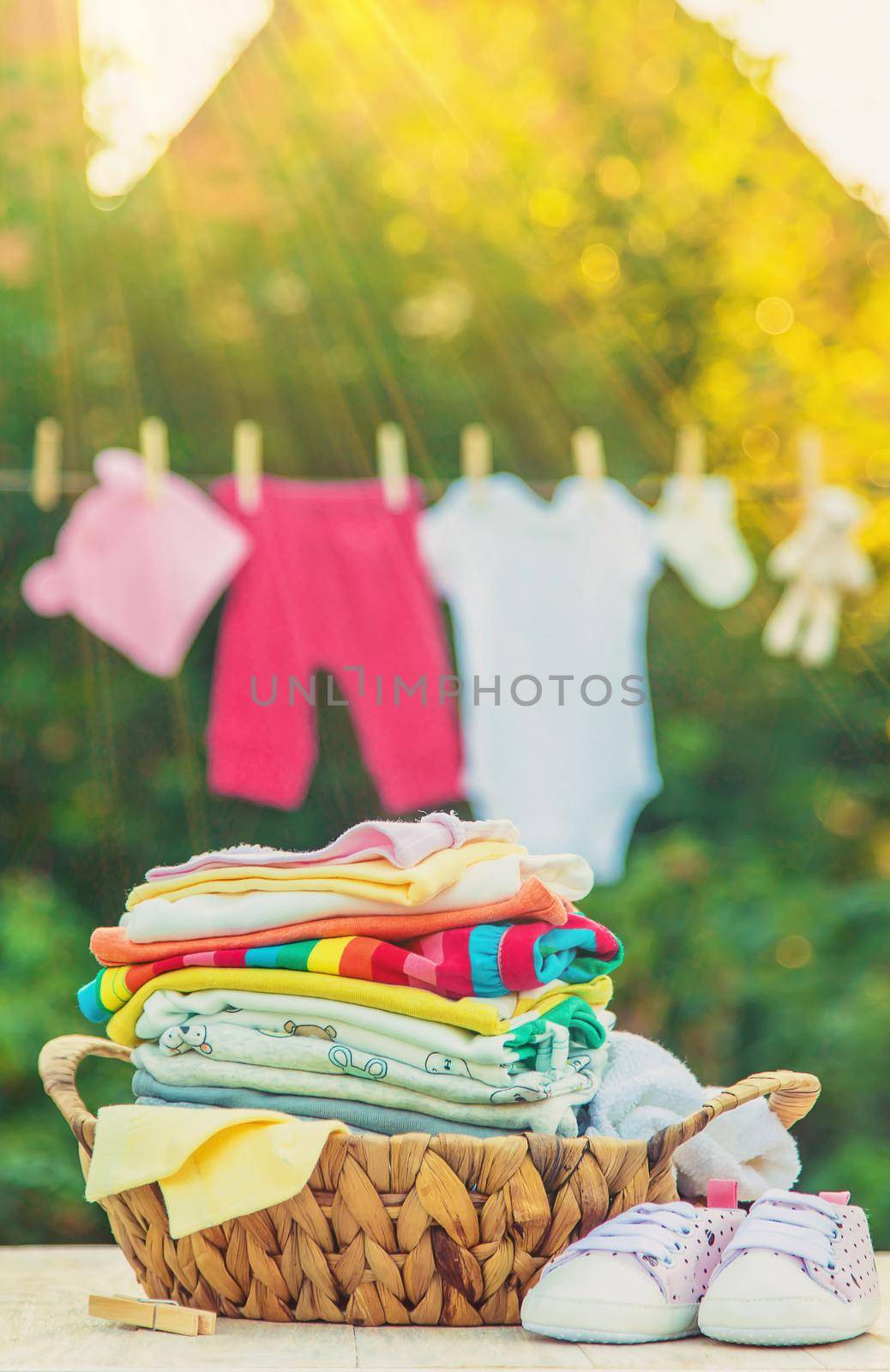 washing baby clothes. Linen dries in the fresh air. Selective focus. by yanadjana