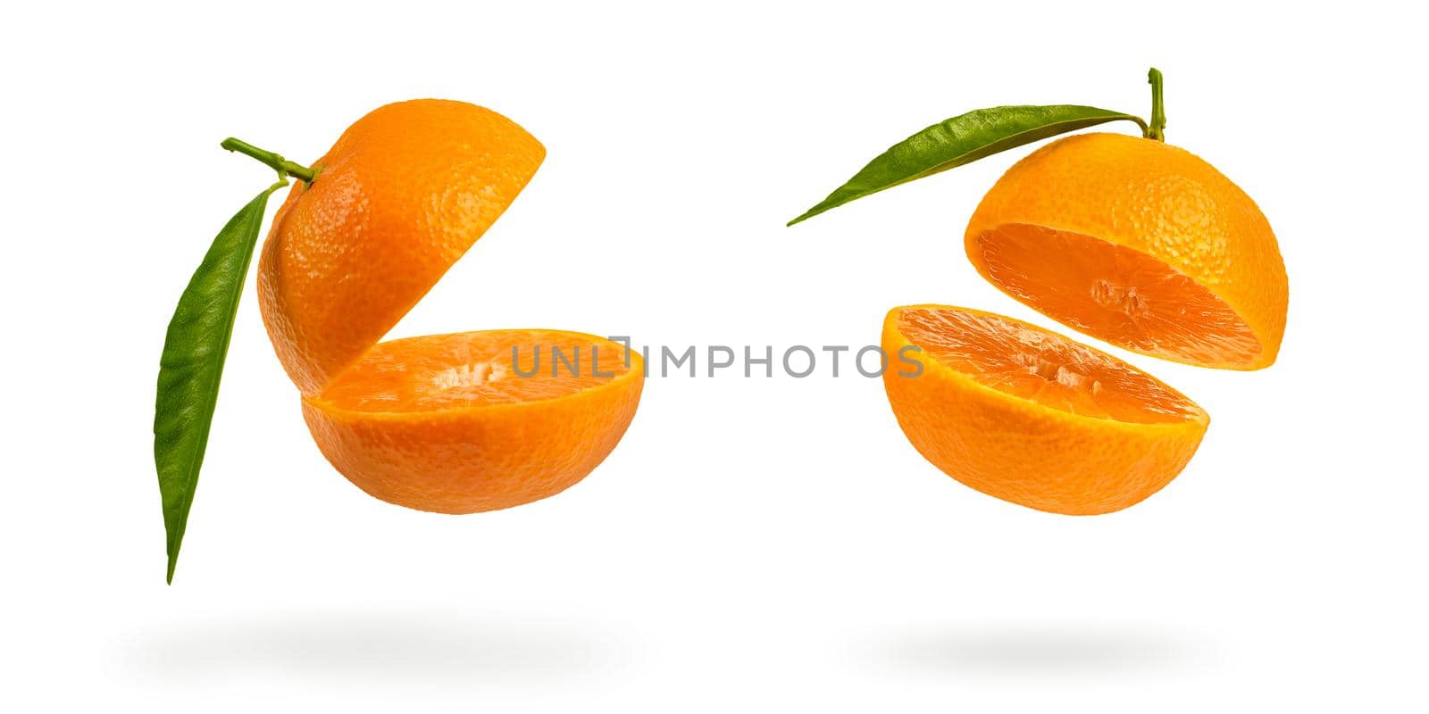 Set mandarin cut in half with a green leaf. Fresh tangerine on a white isolated background. Open mouth concept. Tangerine texture close up. by SERSOL