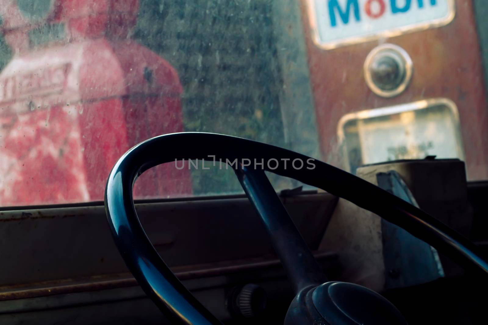 Interior of classic vintage car -parked vintage gas station. Interior of an old automobile with steering wheel close-up. Retro car in soft light effect. Detail of old-timer automobile - vintage photo of inside car salon. by Petrichor