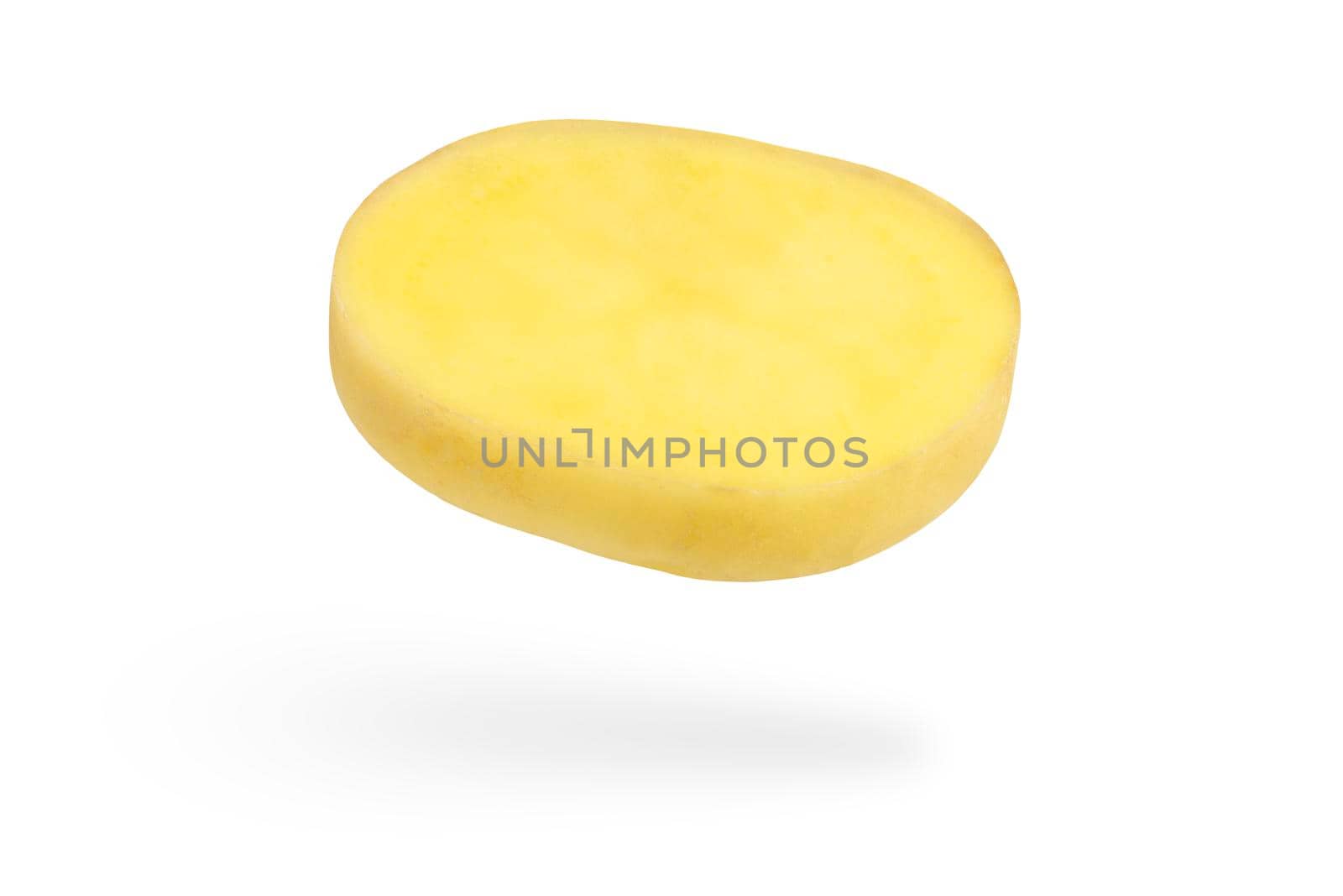 A slice of fresh unpeeled potatoes falls on a white background. Chopped raw potatoes. Food levitation concept. High resolution image.