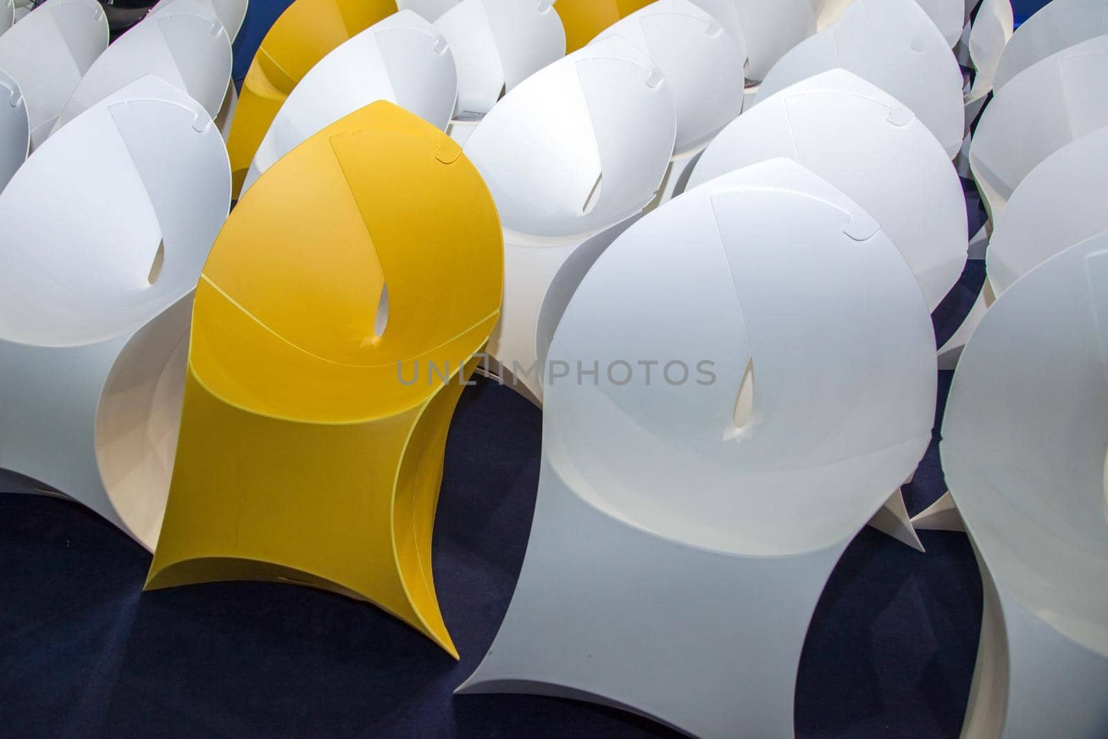 rows of white and yellow creative paper seat place, closeup by Khosro1