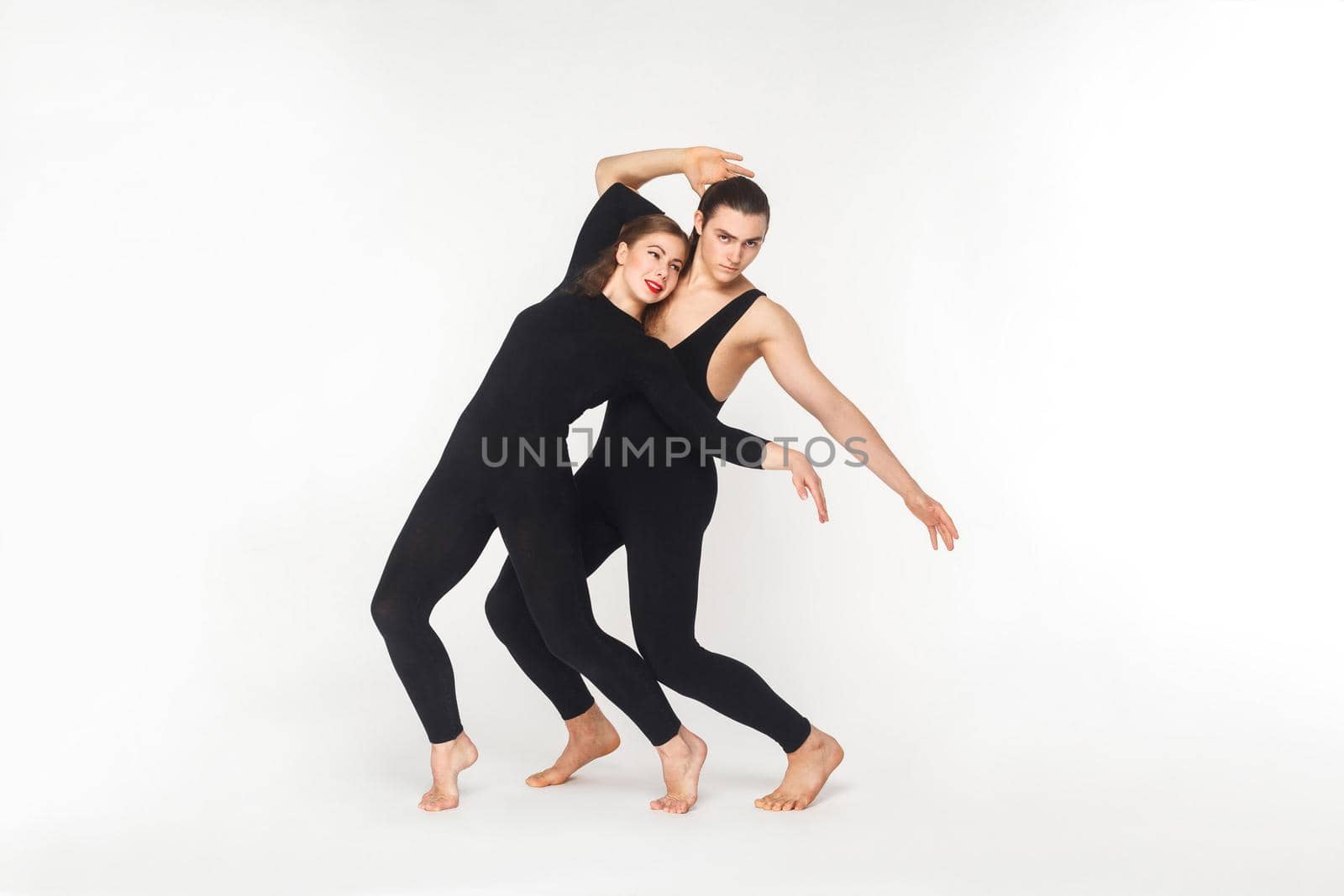 Tenderness sensual couple dancing with love. Studio shot, isolated on white background