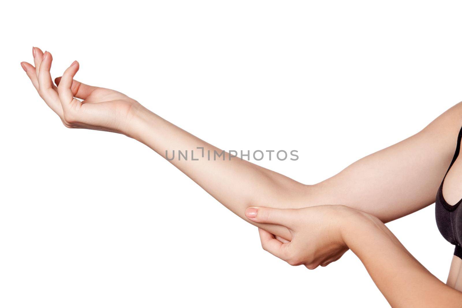 Closeup view of a young woman with elbow pain on white background