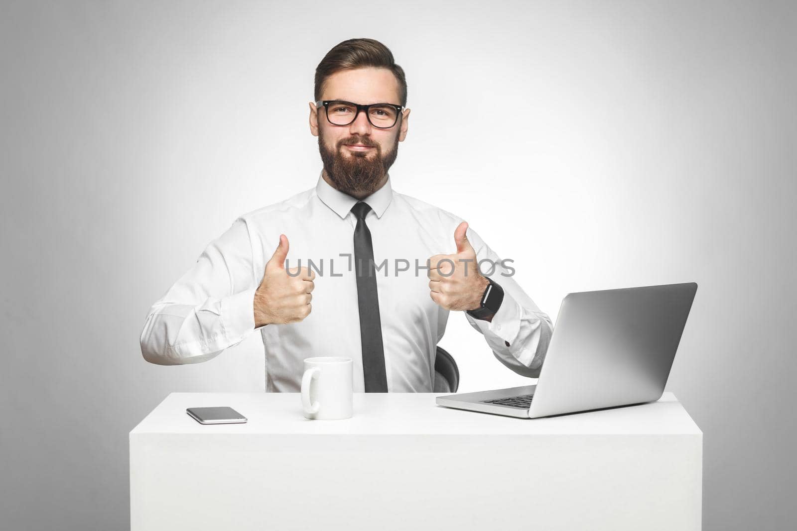 man sitting in office and working on laptop with smile and showing thumb up, by Khosro1
