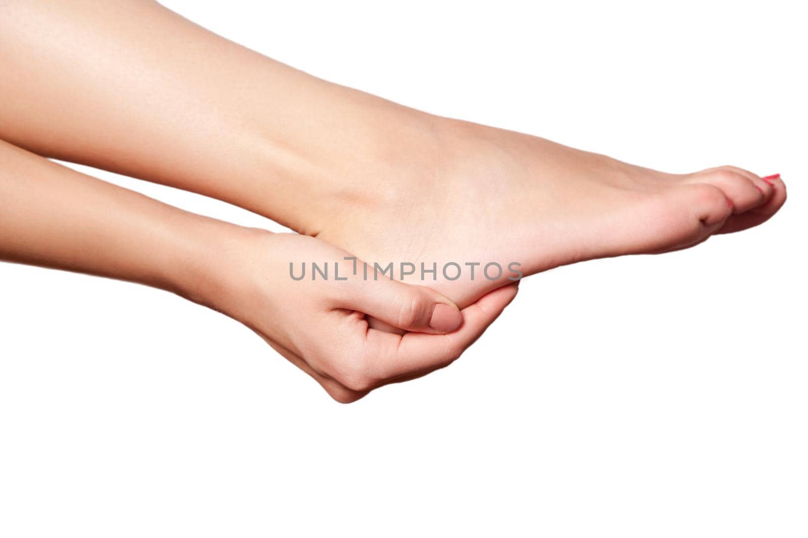Closeup view of a young woman with pain on leg on white background.