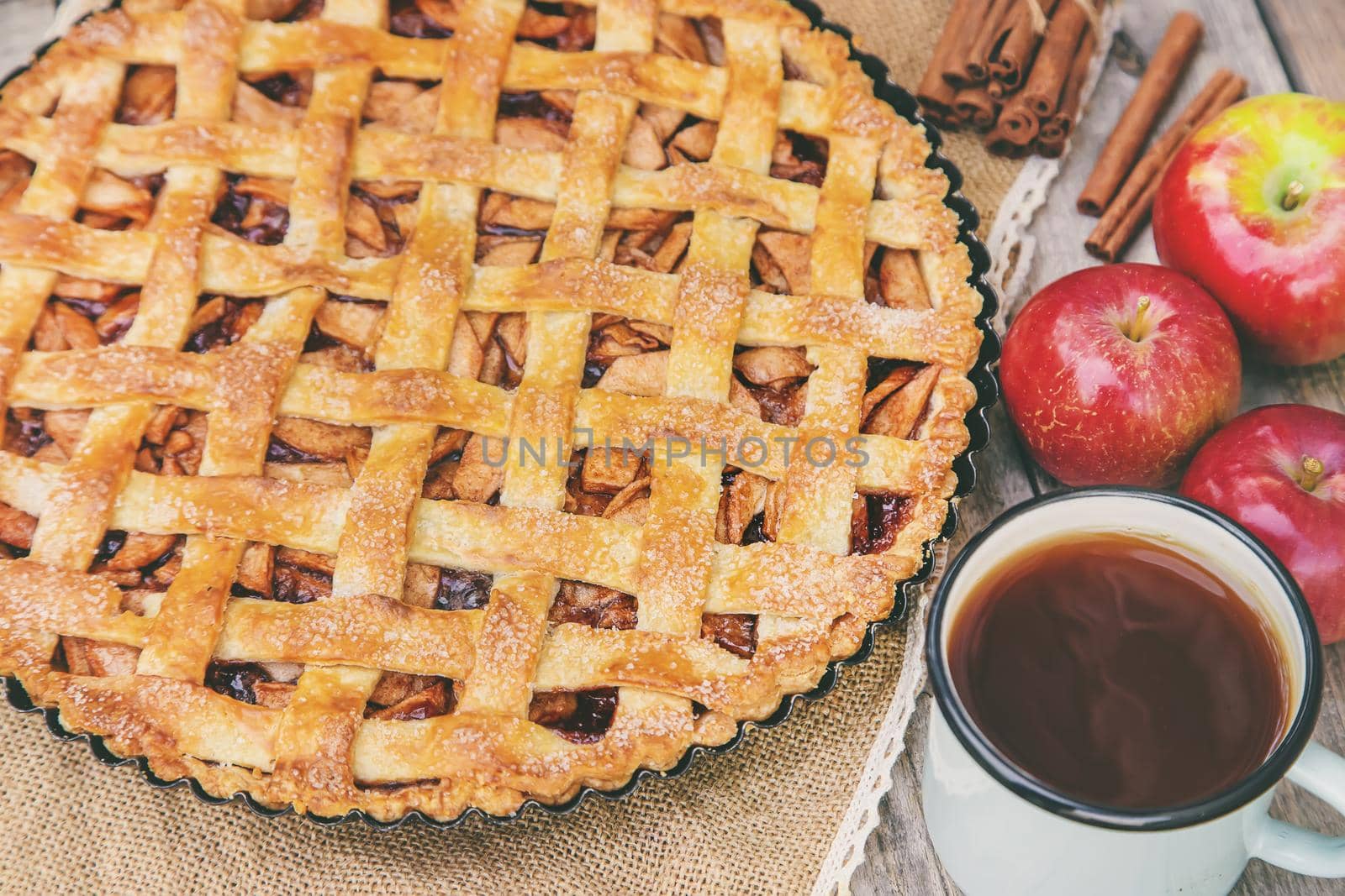 Pie with apples and cinnamon. Selective focus. Food.