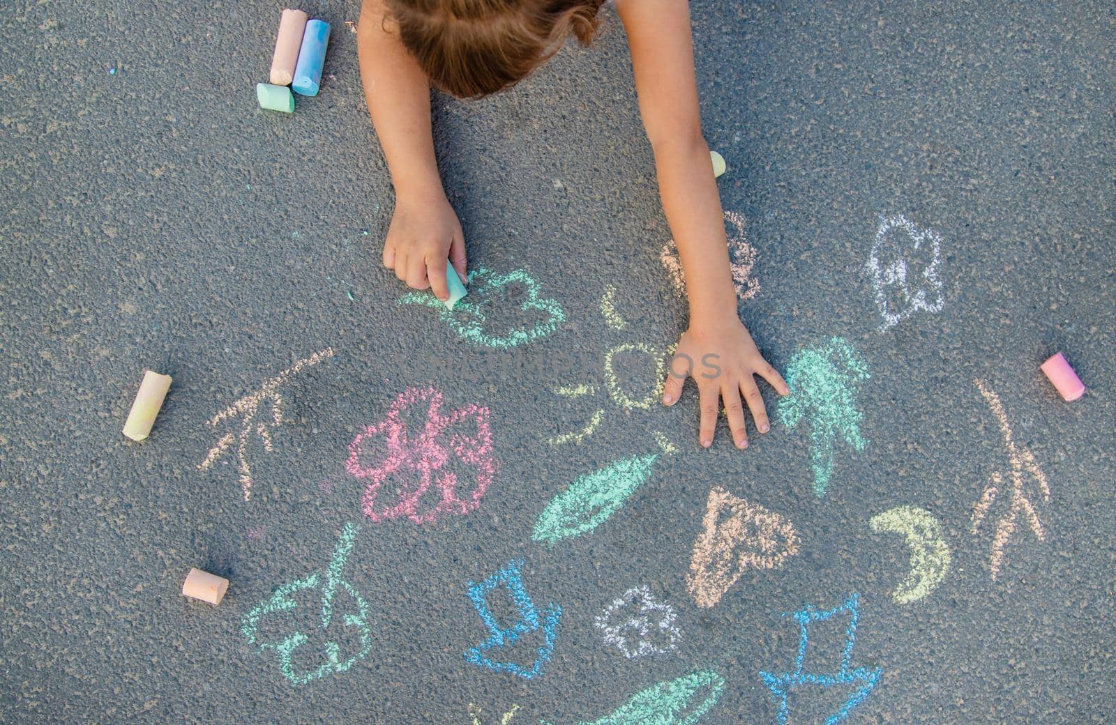 Children's drawings on the asphalt with chalk. Selective focus. nature.