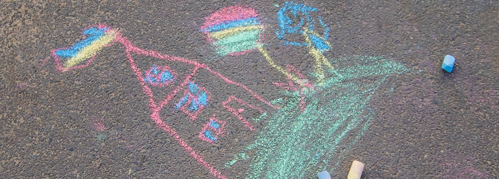 Children's drawings on the asphalt with chalk. Selective focus. nature.