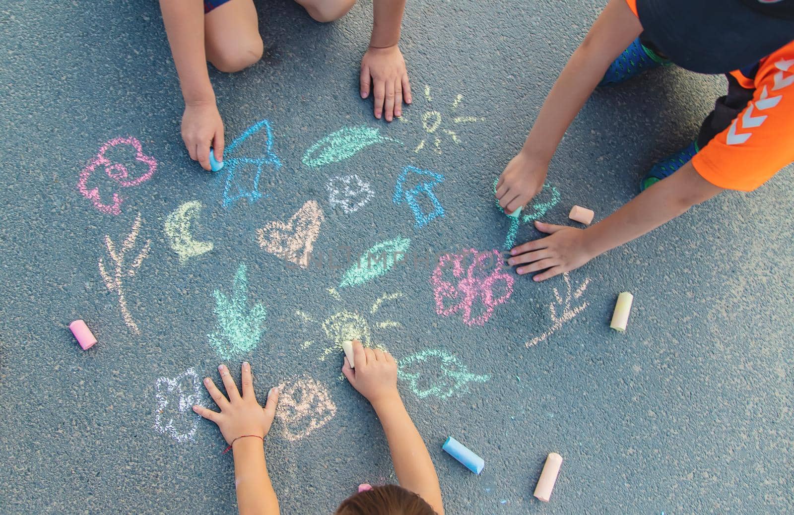 Children's drawings on the asphalt with chalk. Selective focus. nature.