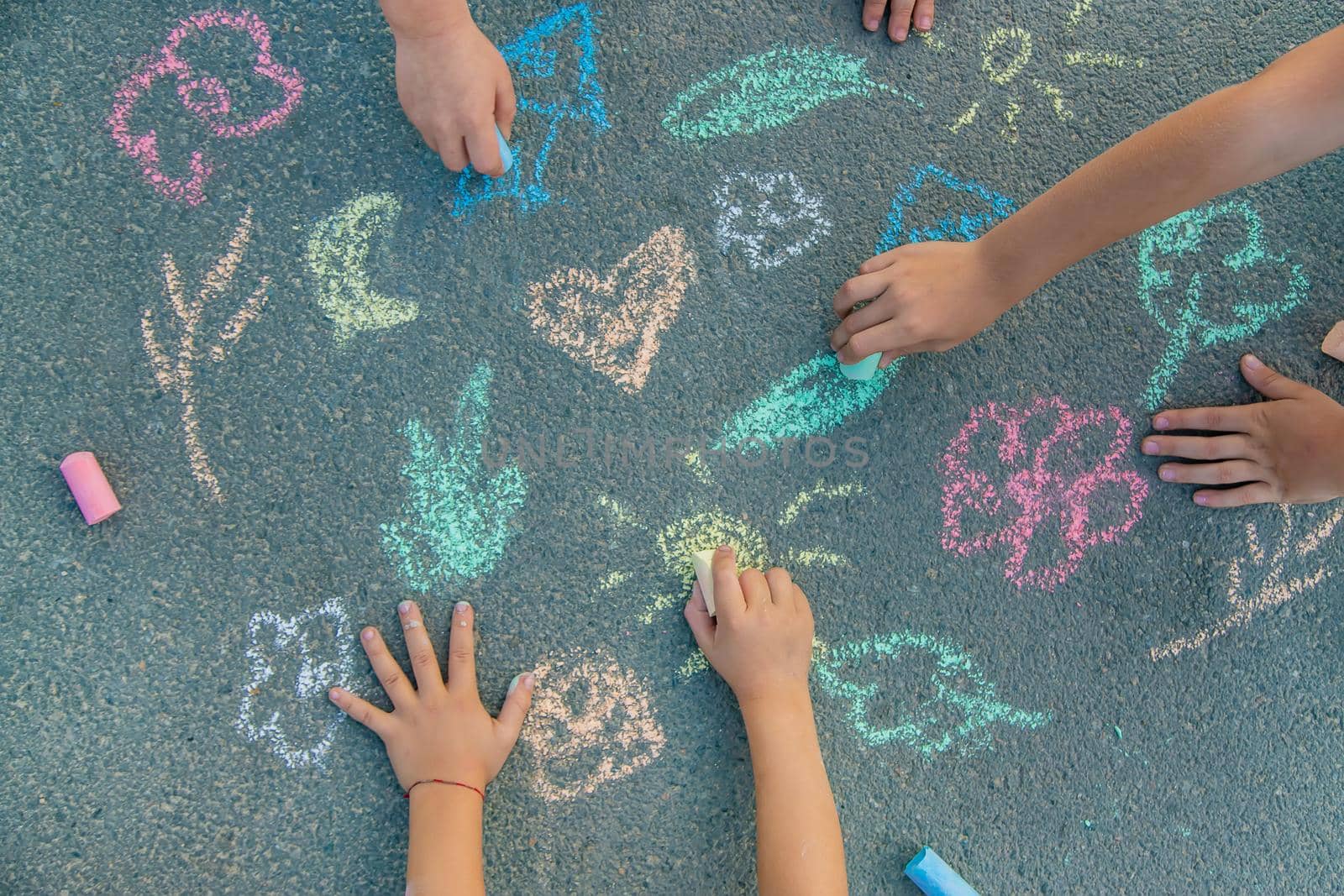 Children's drawings on the asphalt with chalk. Selective focus. nature.