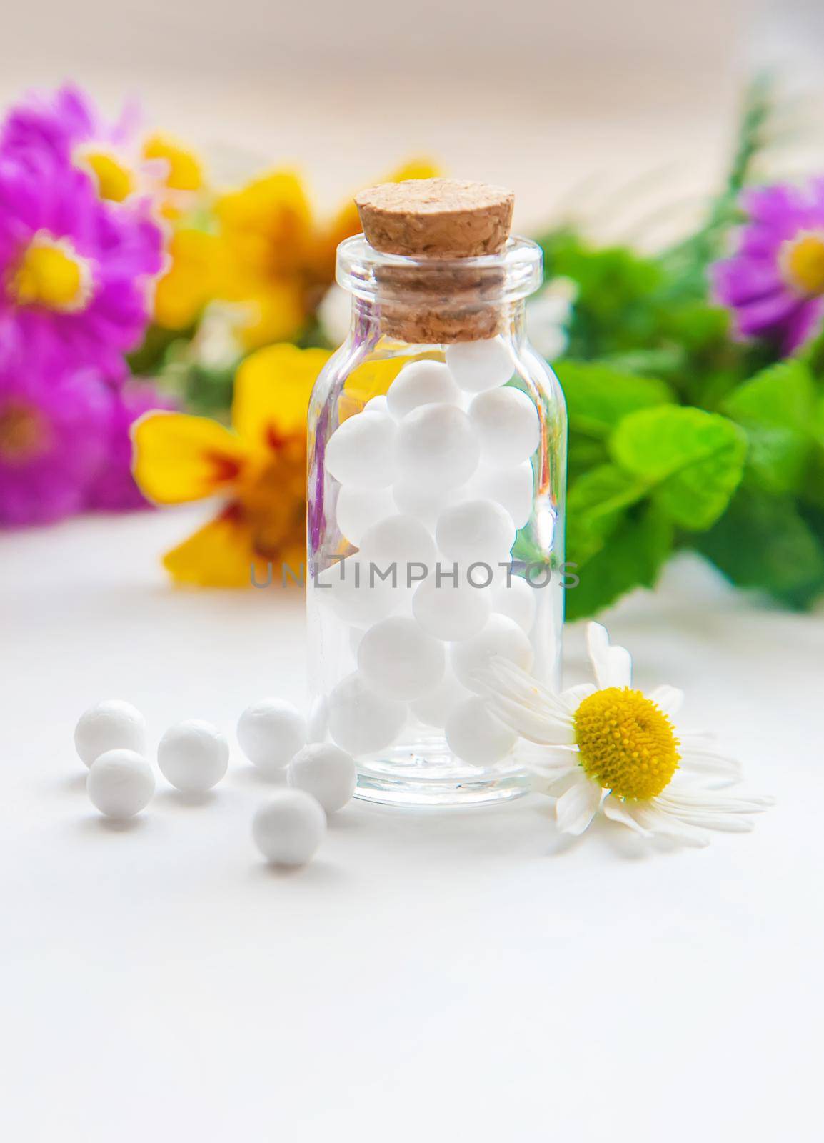 Homeopathy. Herbal extracts in small bottles. Selective focus. nature.