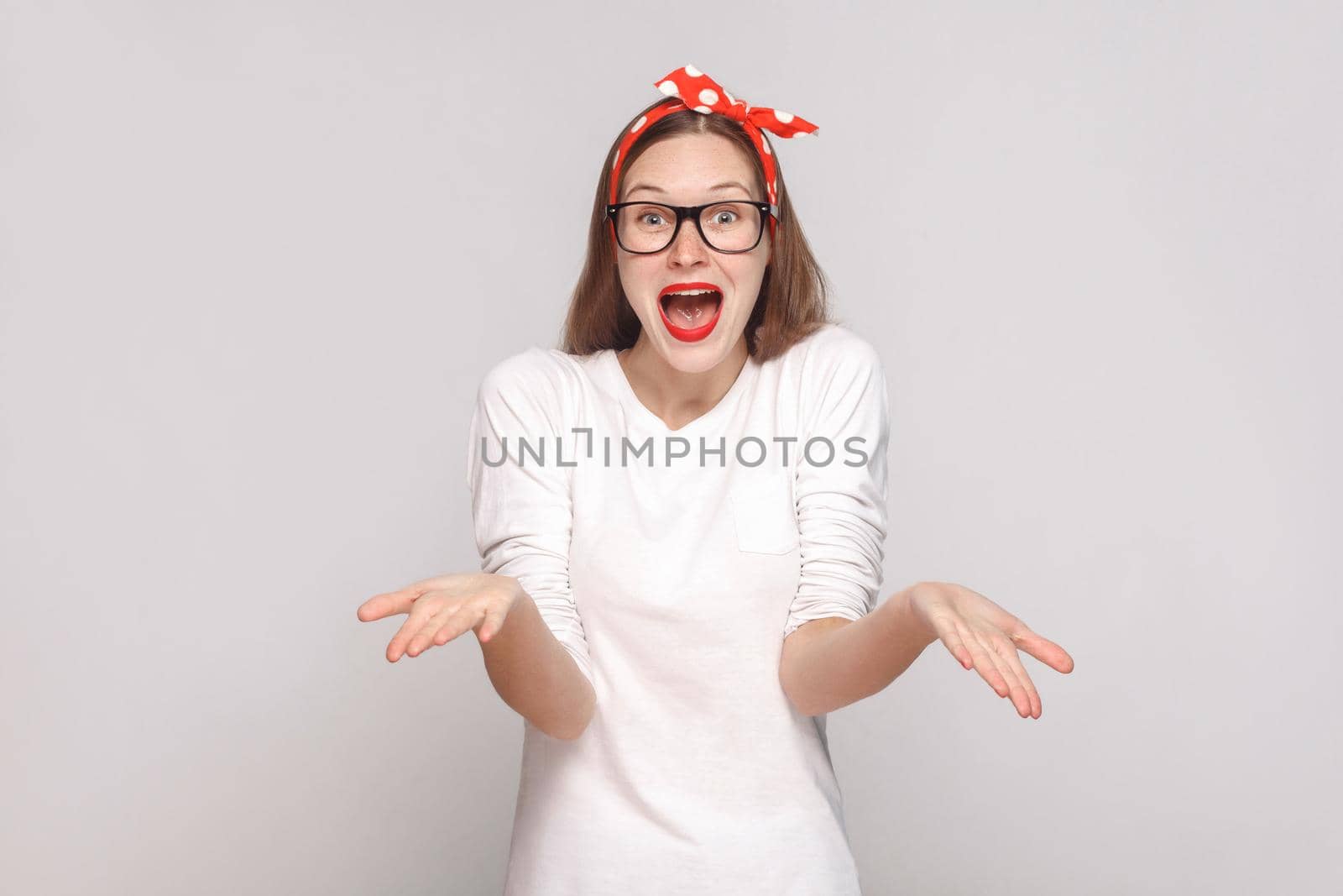 woman in white t-shirt with freckles, black glasses, red lips and head band. by Khosro1